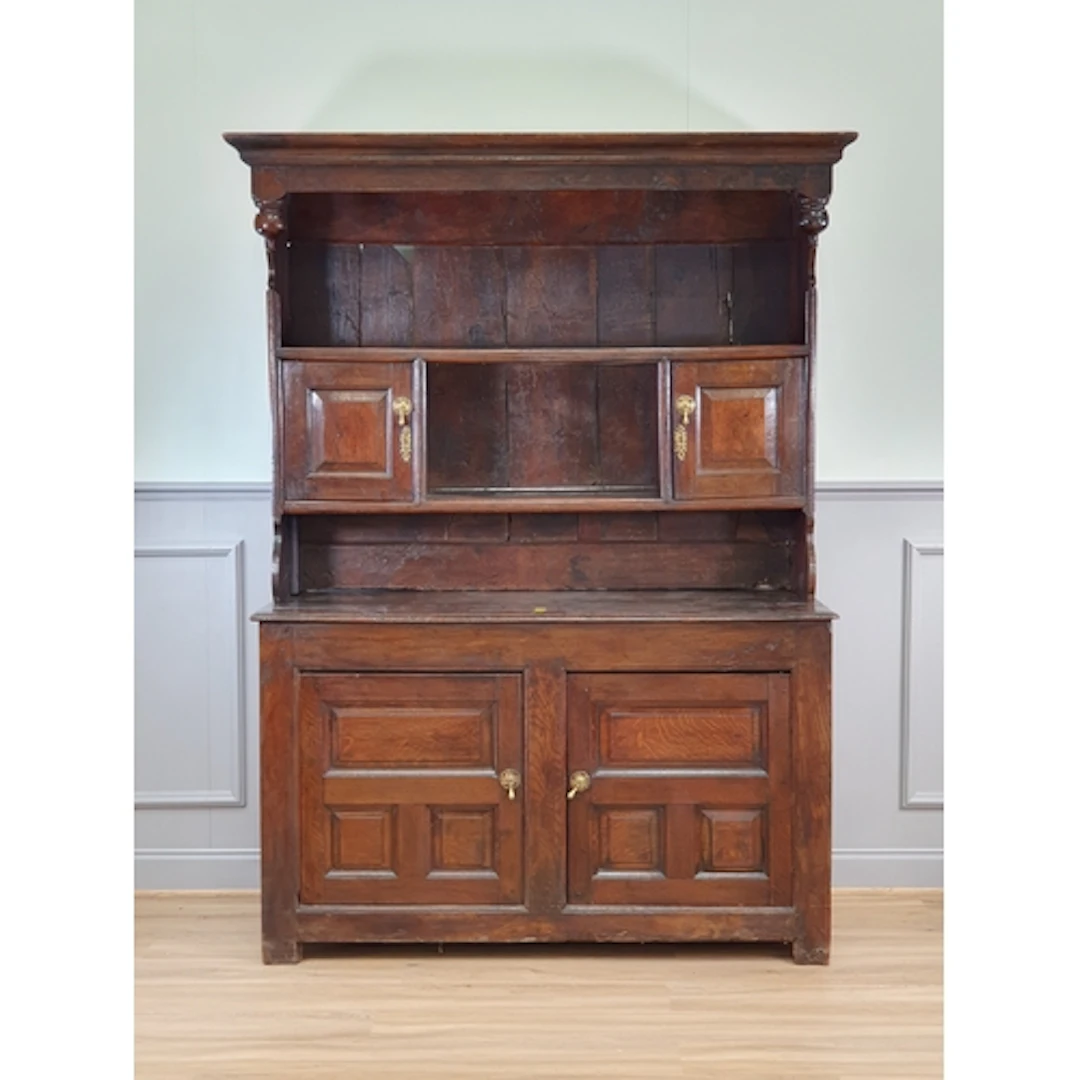 An 18th Century oak Canopy Dresser, the rack fitted pair of ...