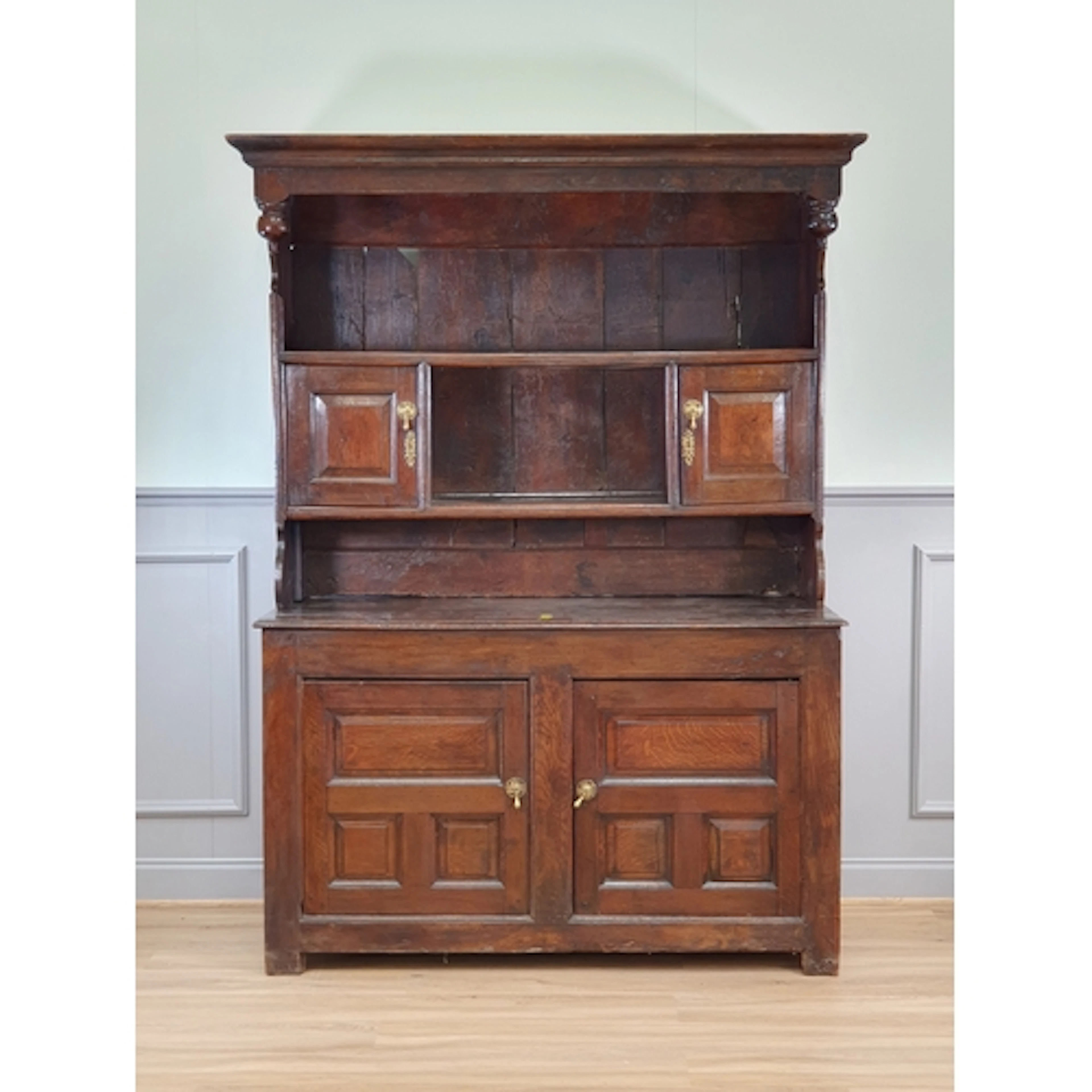 An 18th Century oak Canopy Dresser, the rack fitted pair of ...