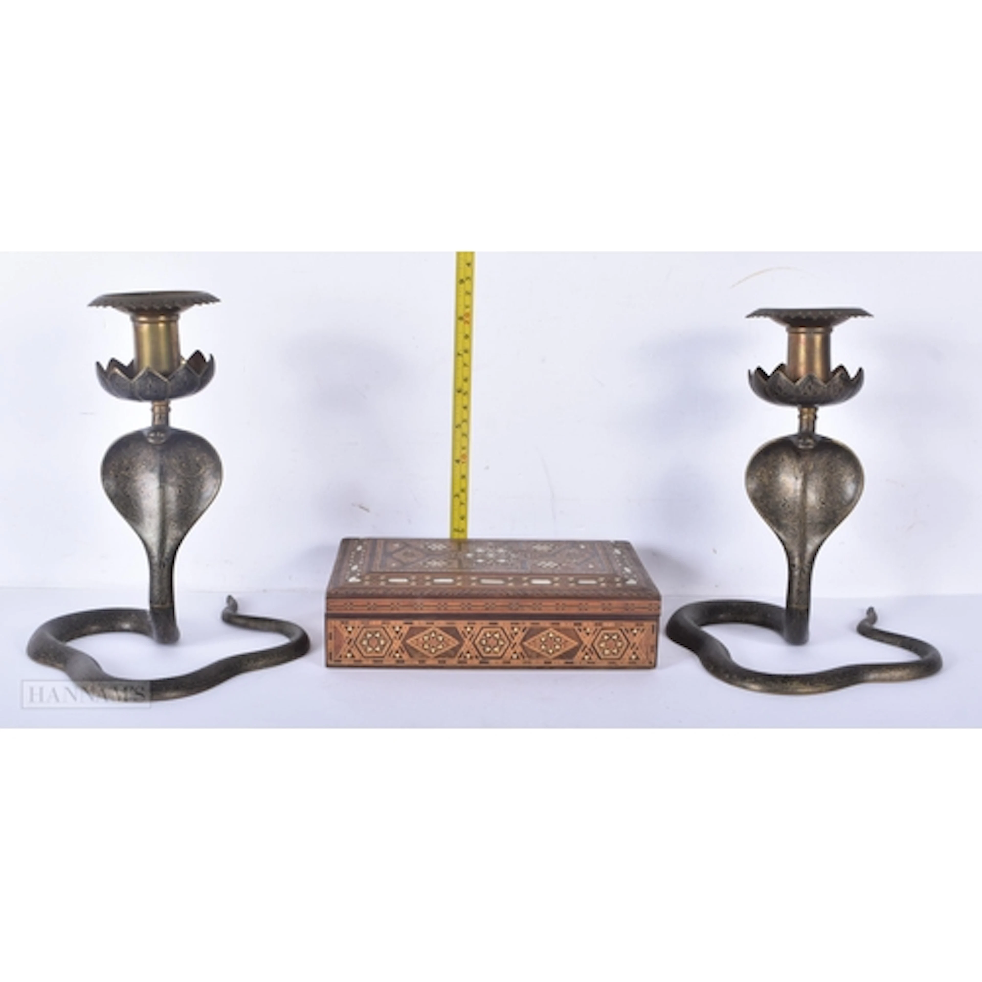 A pair of Anglo Indian brass Cobra candlesticks together wit...