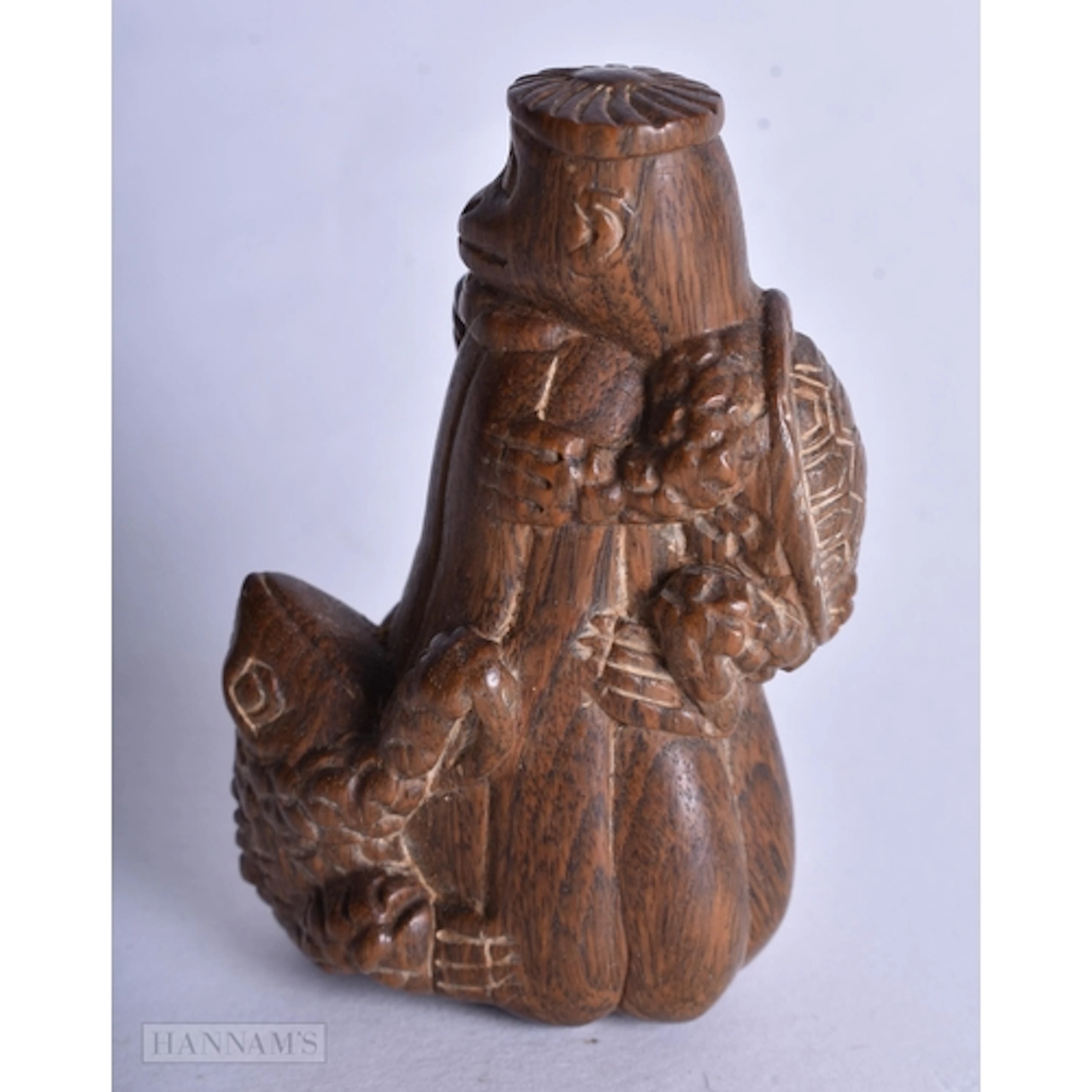 A CARVED WOOD FROG AND MONKEY NETSUKE. 5.9 x 4 x 2.4 cm