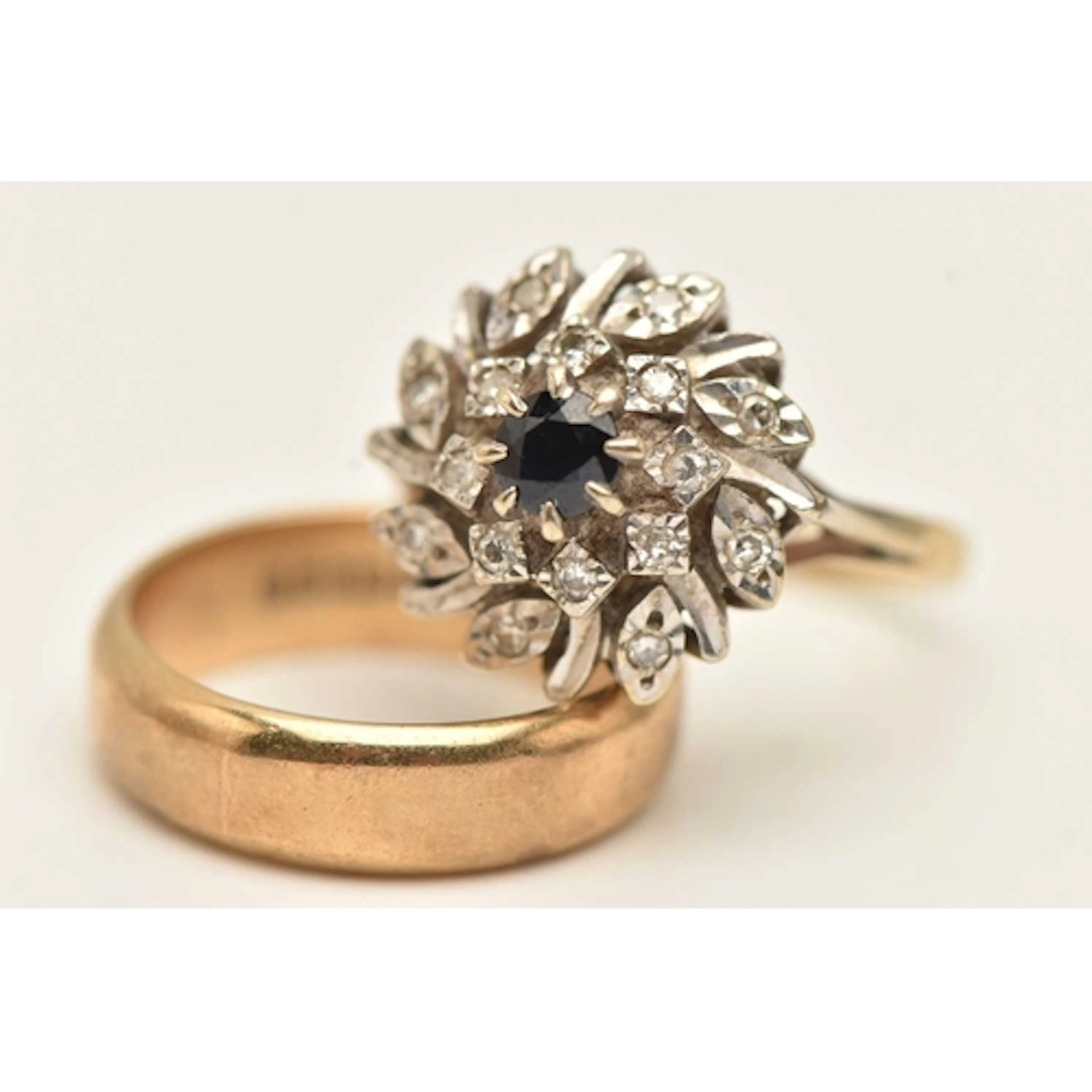 TWO RINGS, to include a yellow gold plain polished band ring...