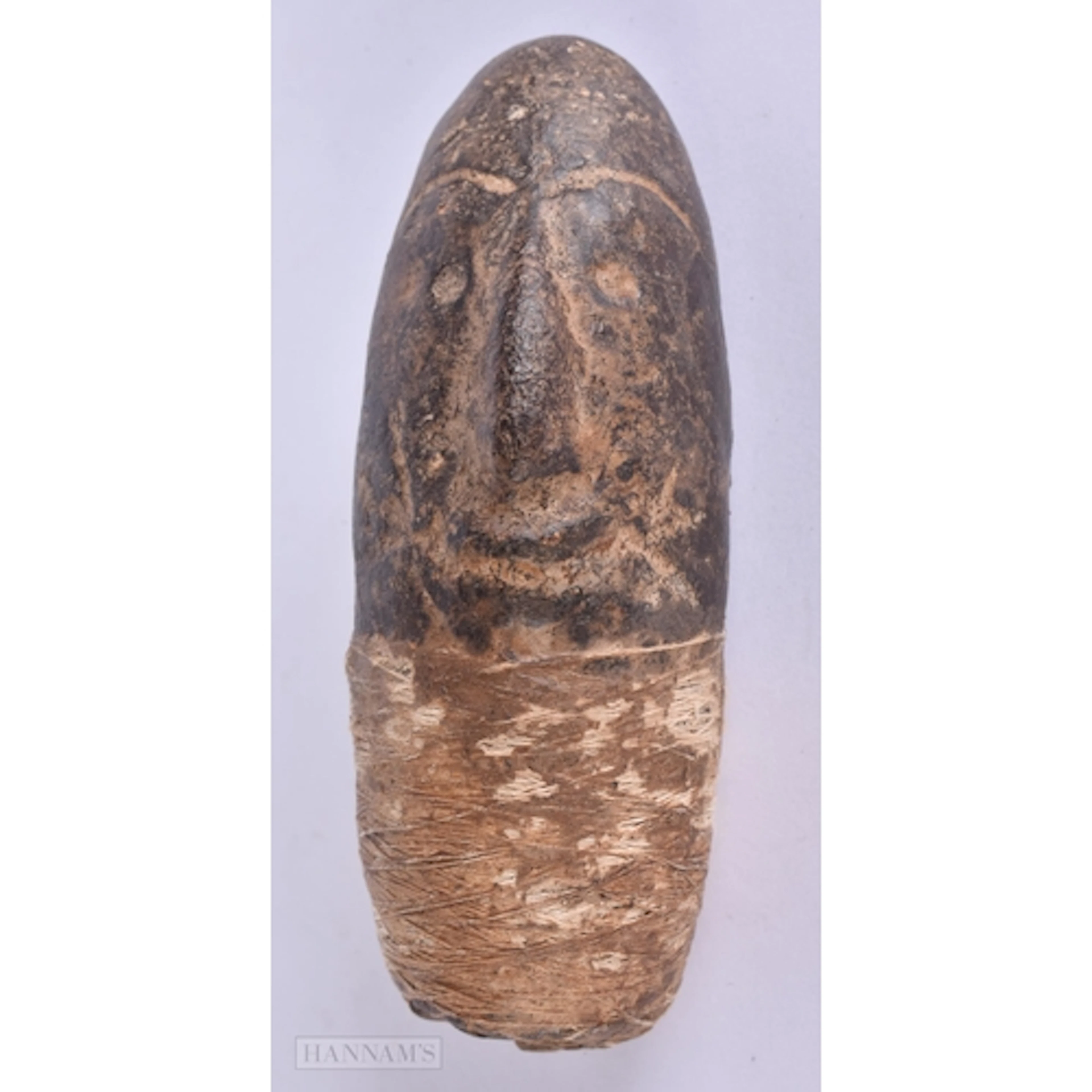 AN UNUSUAL ANTIQUE CARVED STONE TRIBAL HEAD possibly formerl...