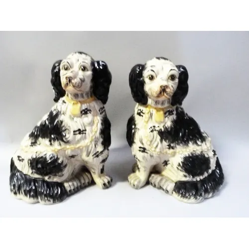Pair of Staffordshire pottery mantel dogs modelled as a King...