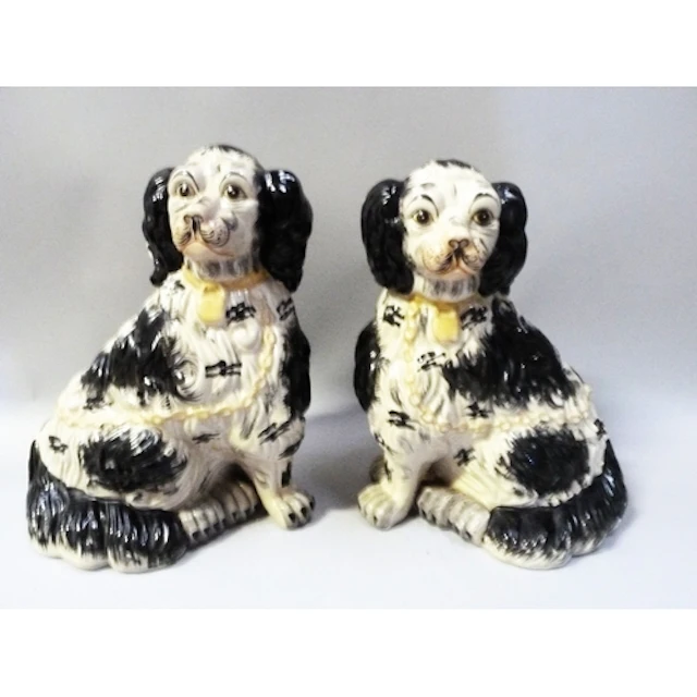 Pair of Staffordshire pottery mantel dogs modelled as a King...