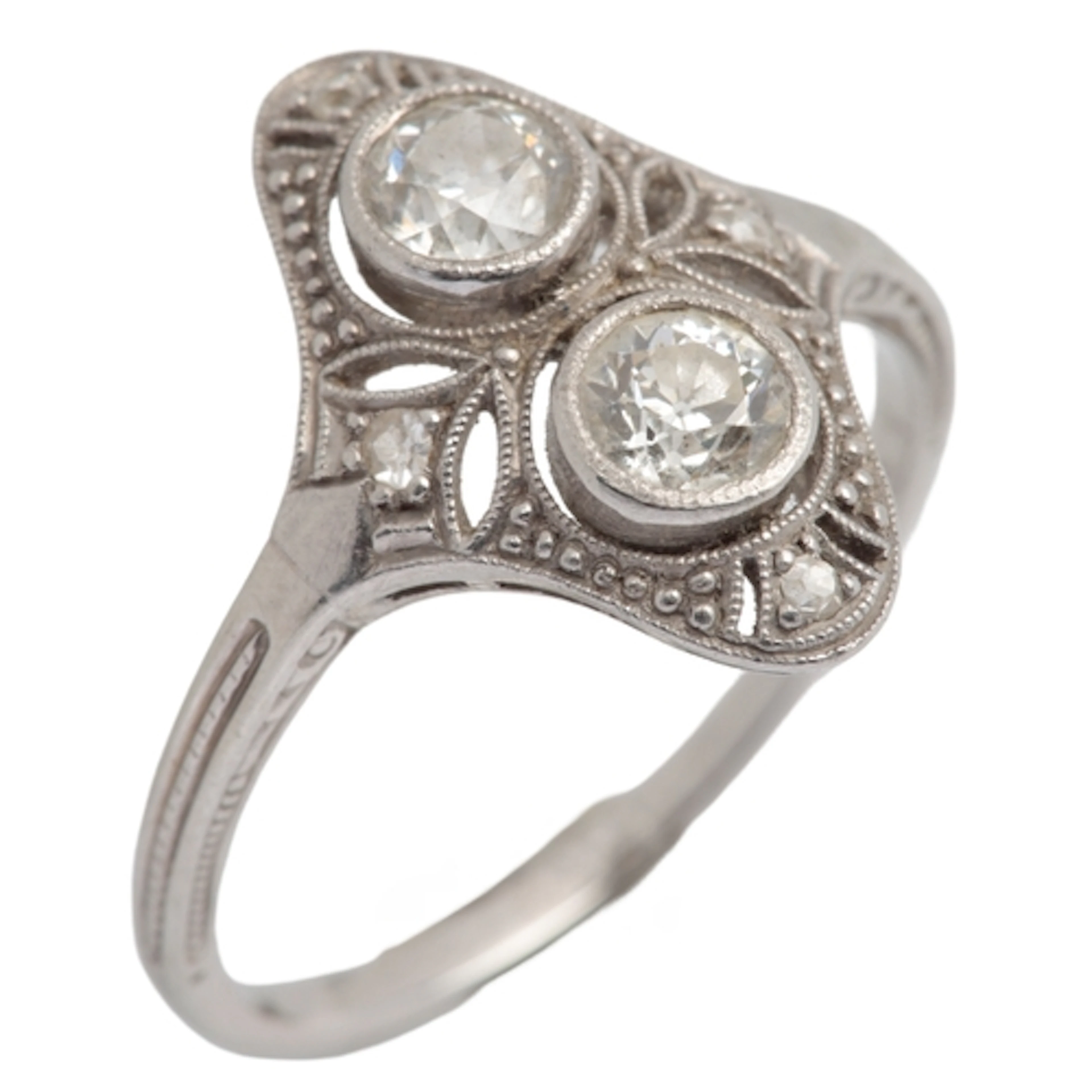 A diamond ring, designed as an openwork panel, collet-set wi...