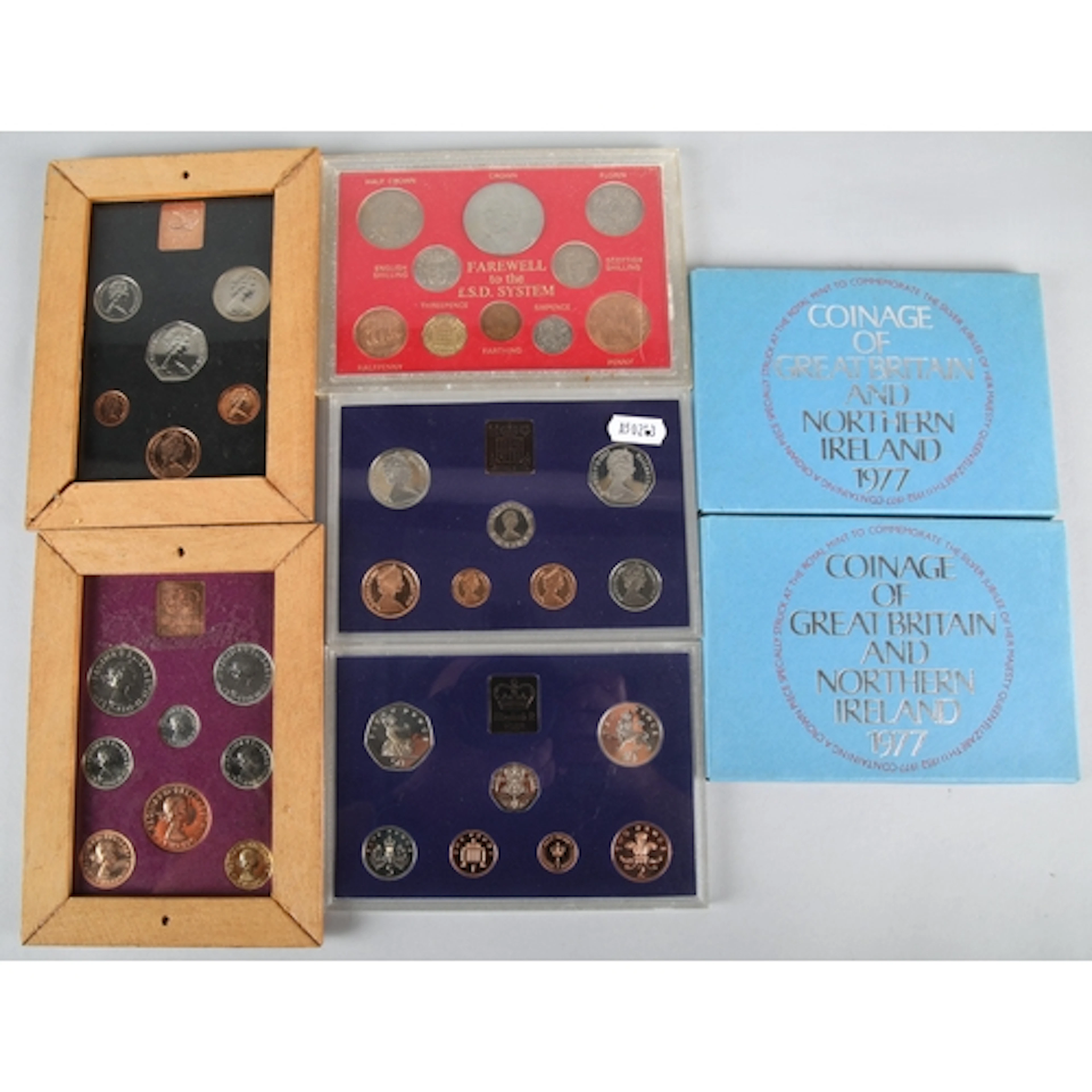 Seven assorted British coin sets