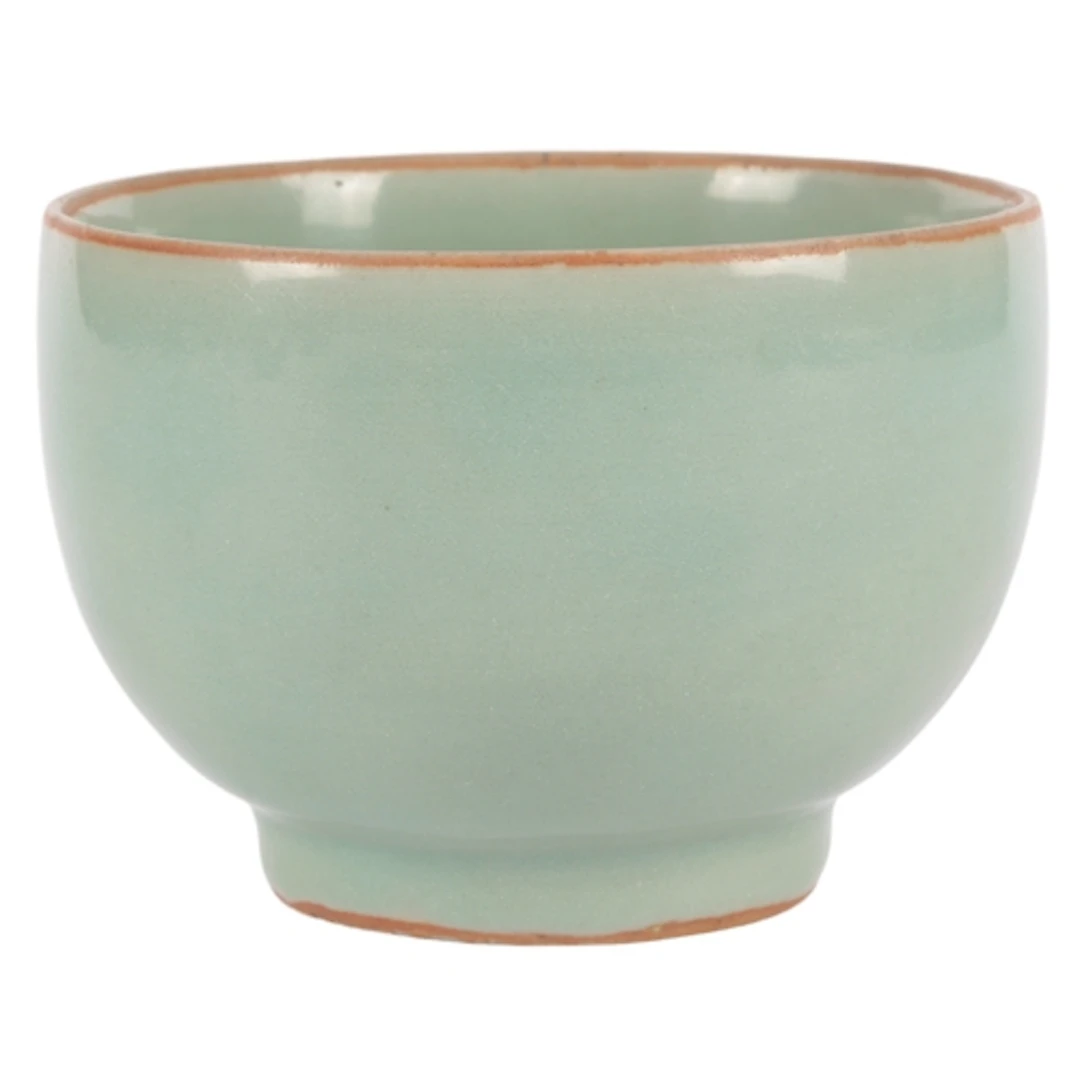 A Chinese celadon bowl, Song dynasty or later, burnt orange ...