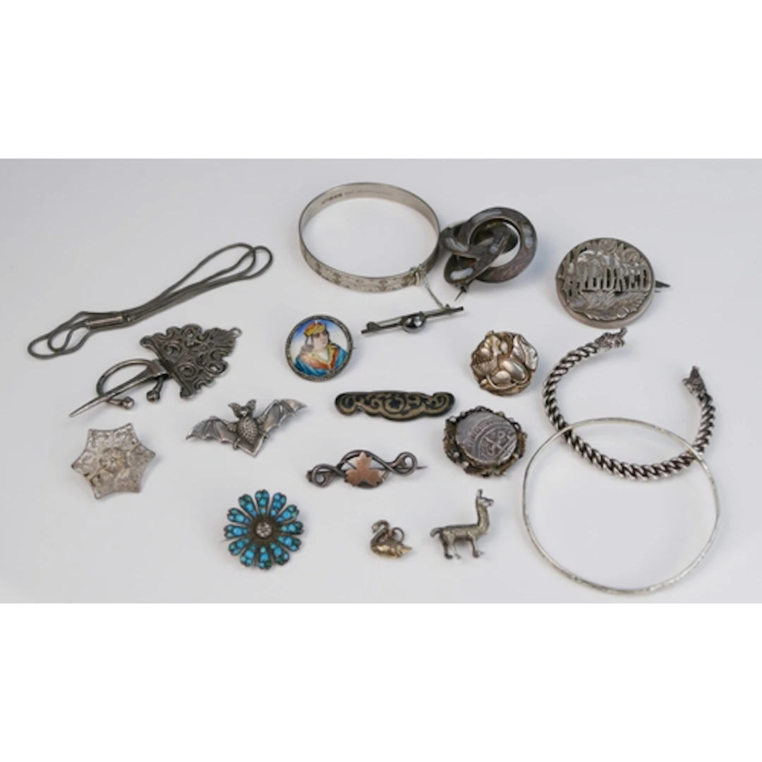 A selection of silver, precious white metal and white metal ...