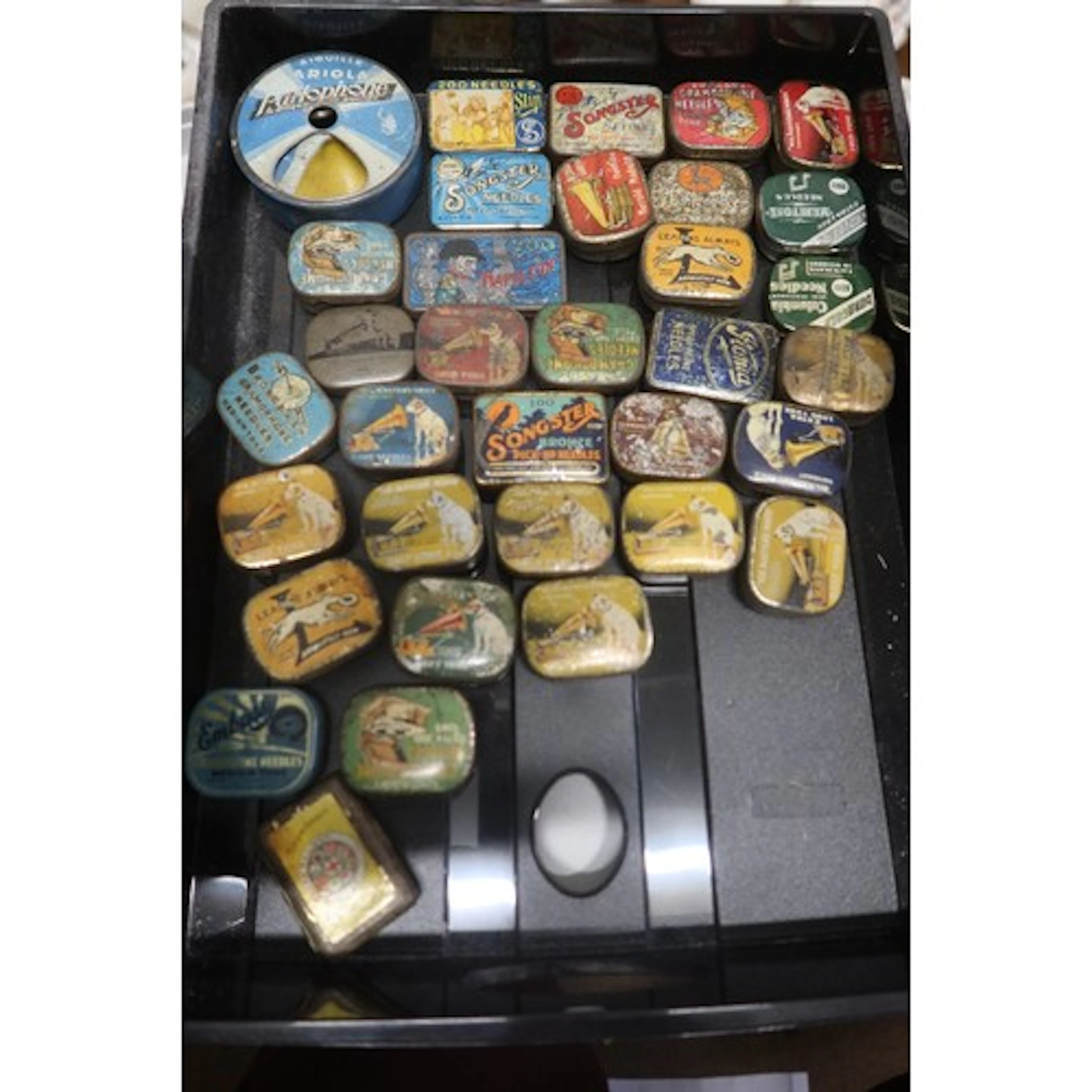 A tray of vintage gramphone needle tins