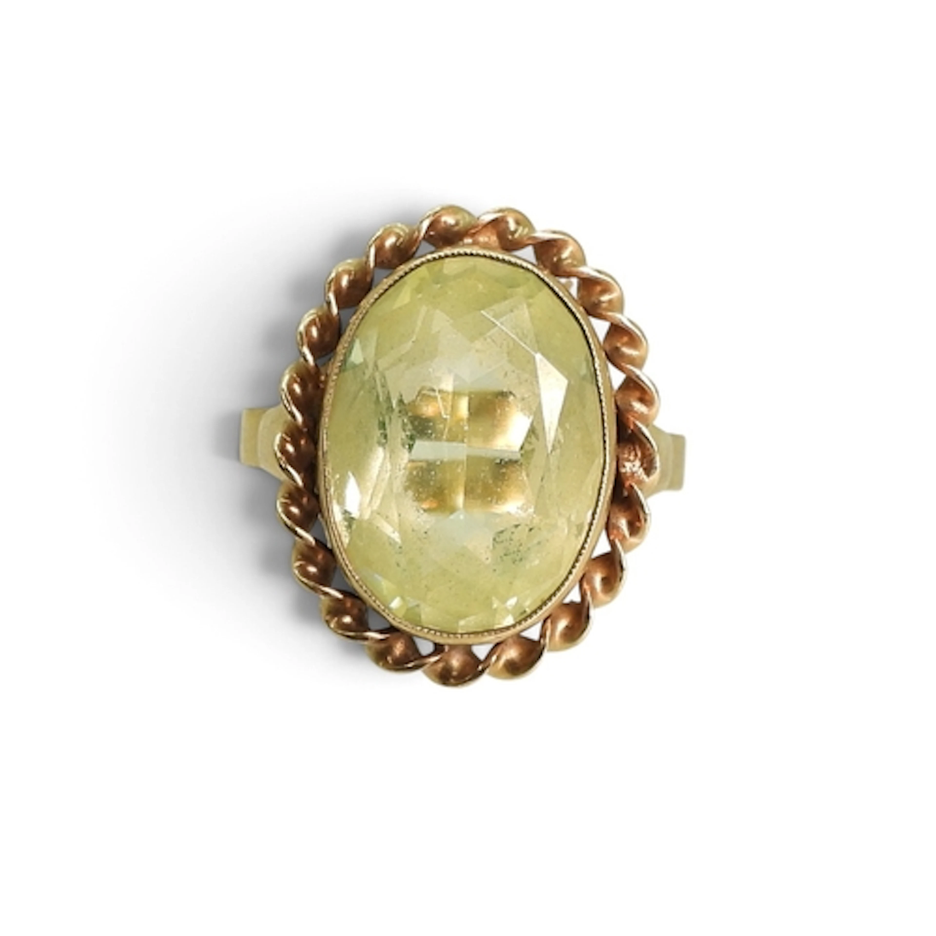A yellow metal ring set with a Uranium glass gem, size S1/2,...