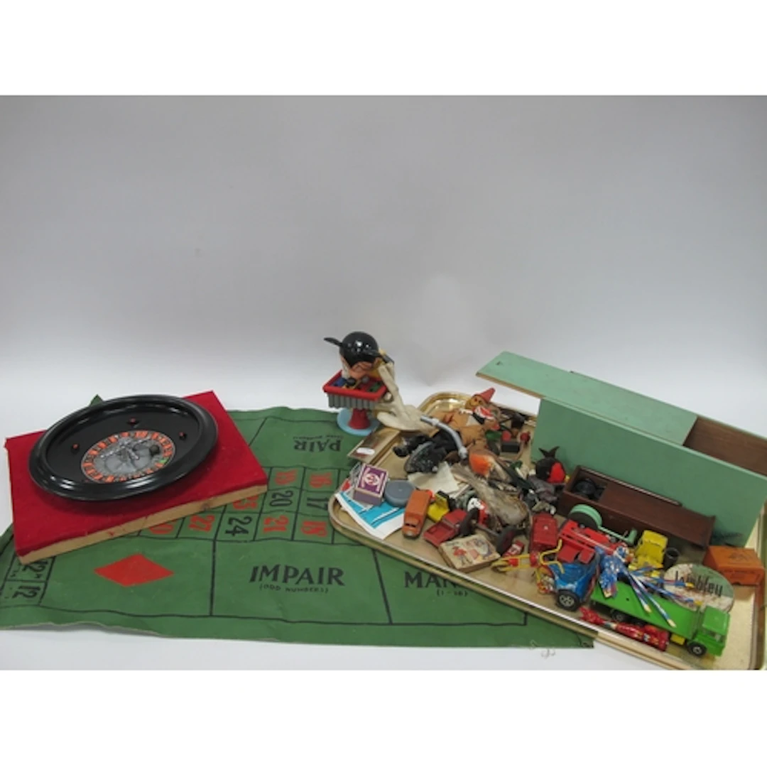 A Mid 1900s Roulette Wheel and Cloth Table Board, plus a tra...