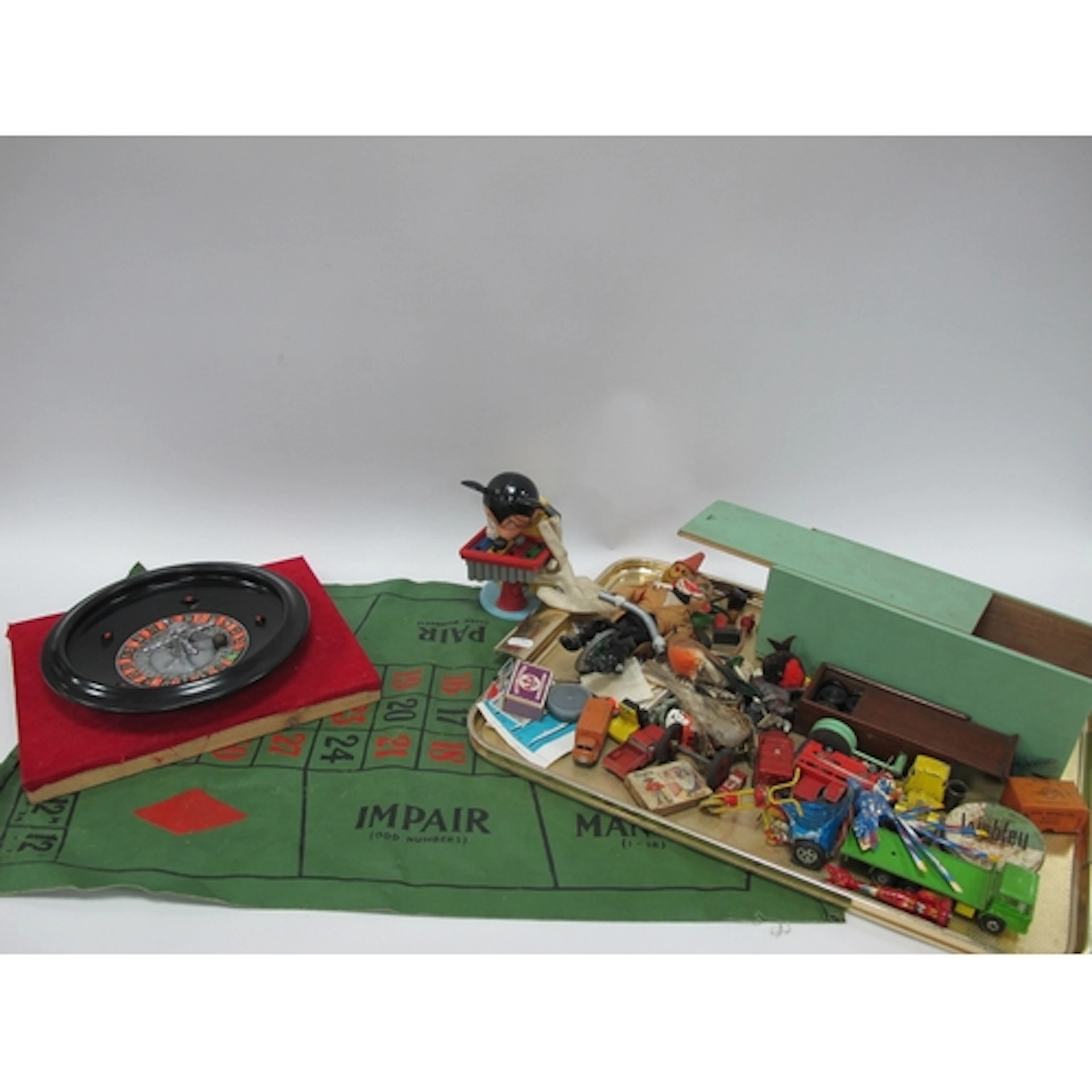 A Mid 1900s Roulette Wheel and Cloth Table Board, plus a tra...