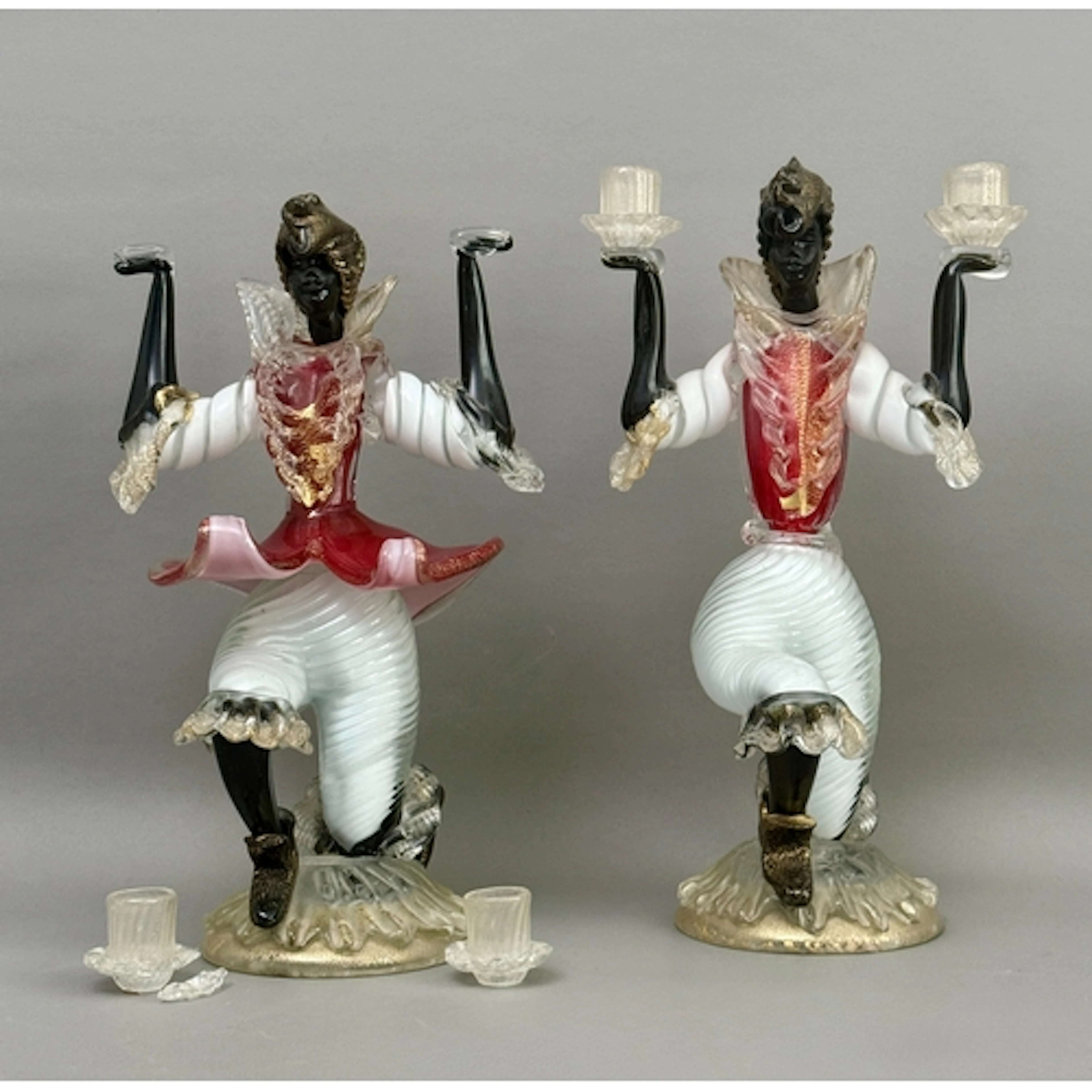 A pair of Italian Murano glass figural blackamoor candlestic...