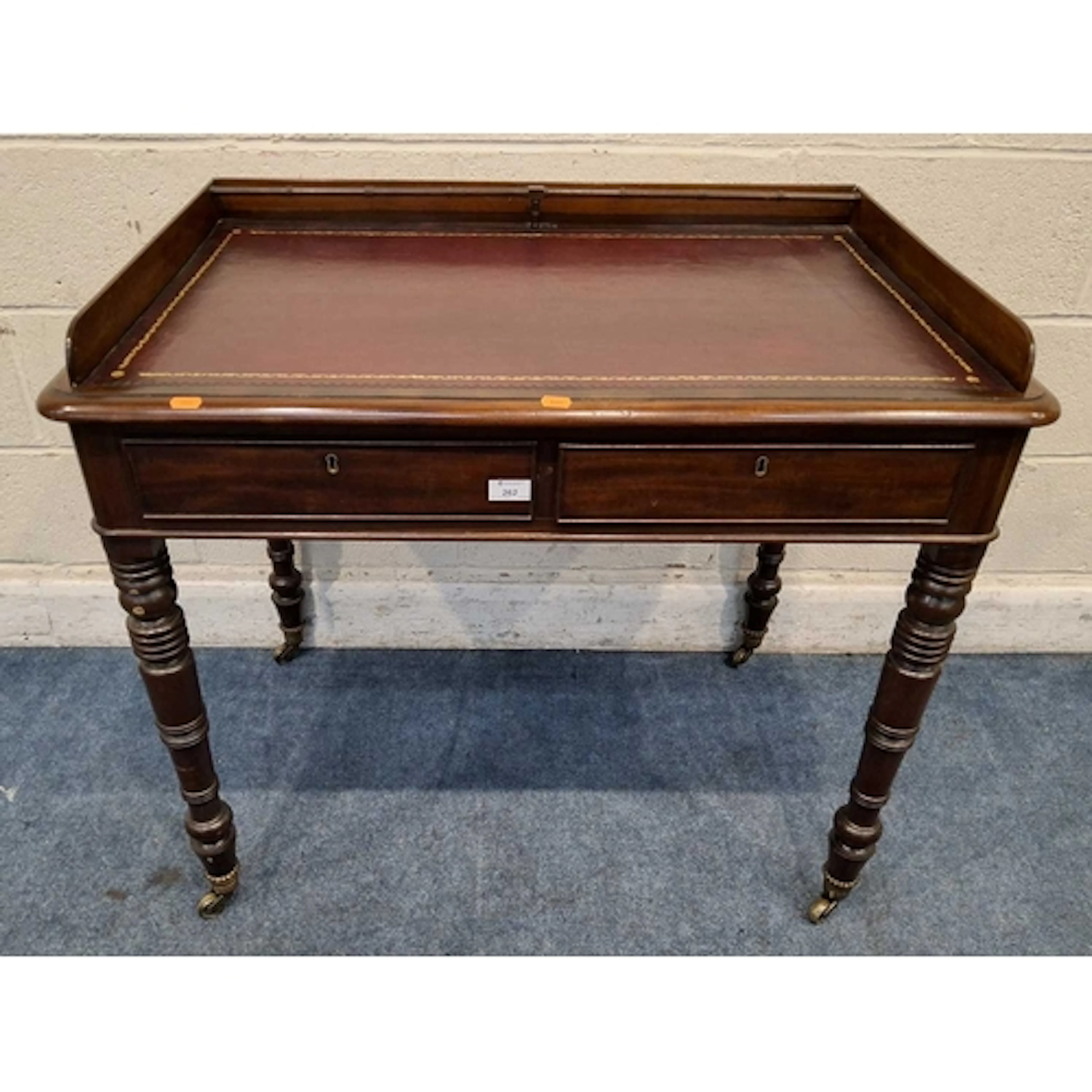A 19TH CENTURY MAHOGANY WRITING DESK, with a raised gallery ...