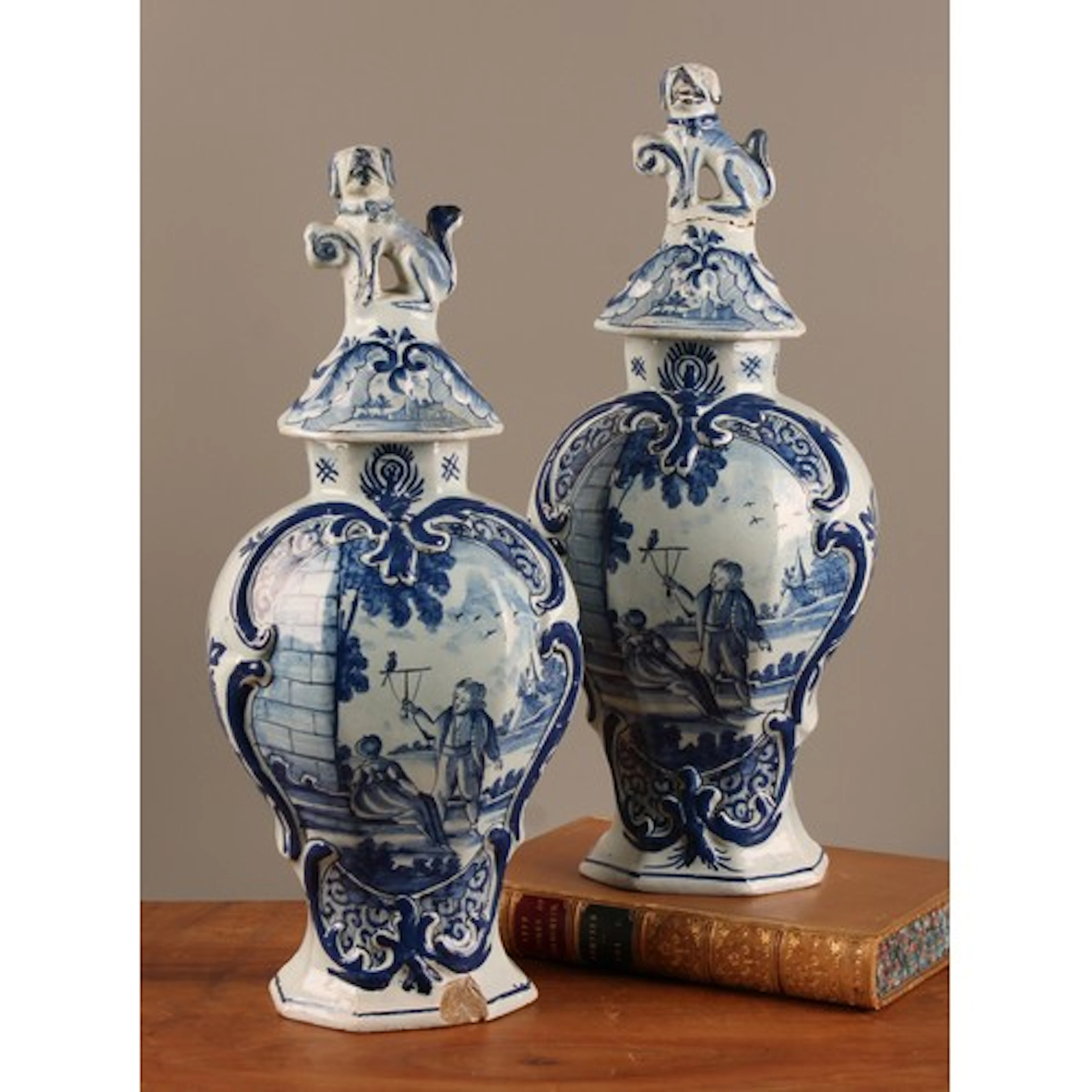 A pair of 18th century Dutch Delft vases and covers, De Porc...