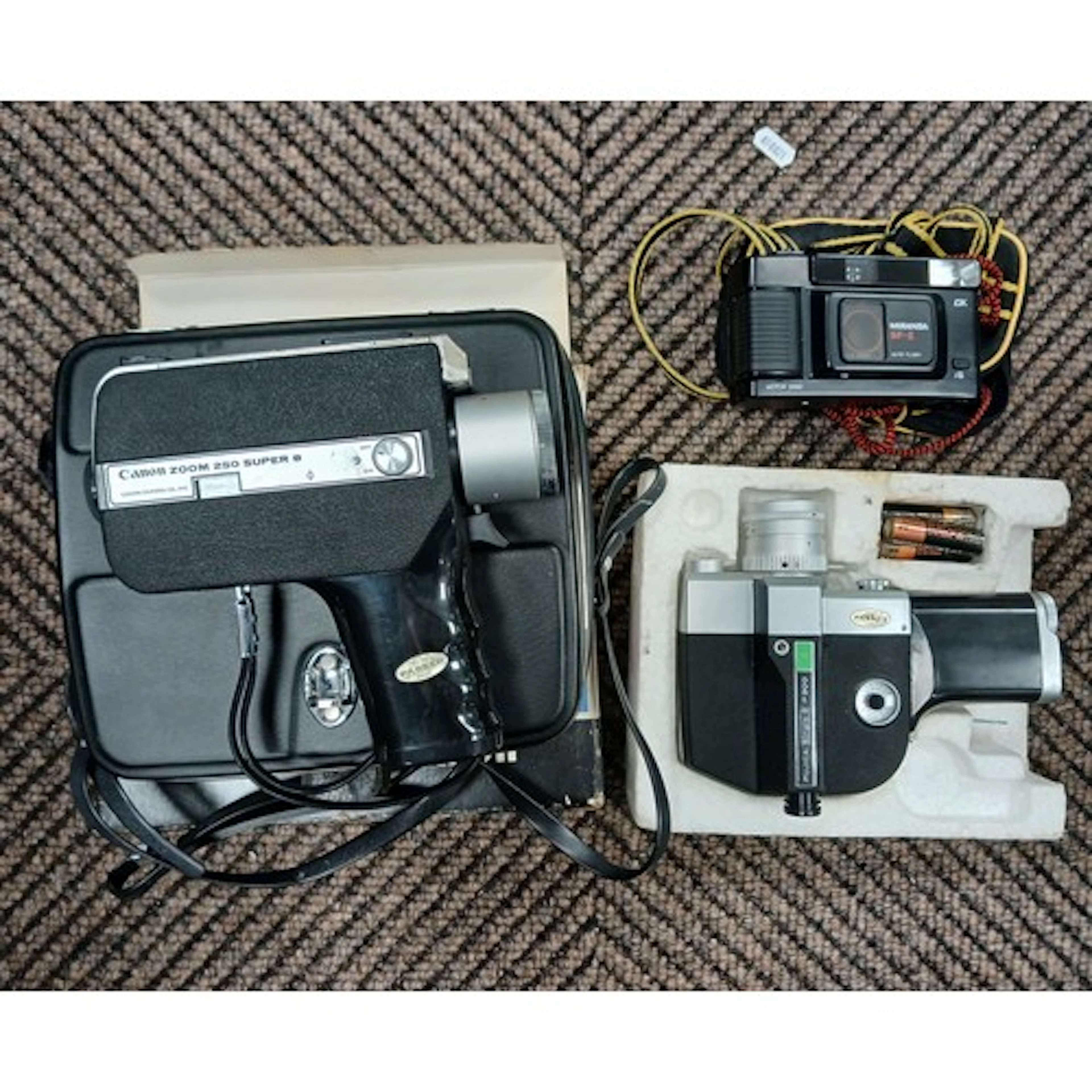 Canon movie camera, a Fujica movie camera also a Miranda dig...