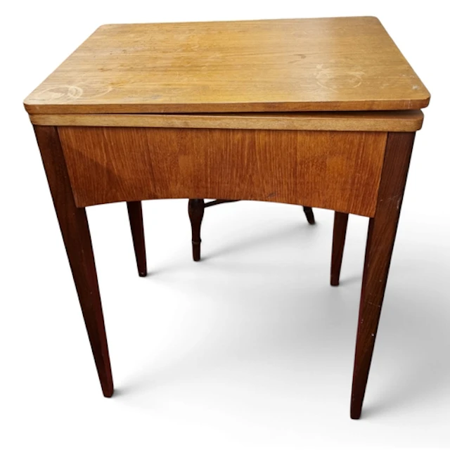 A Treadle Singer Sewing Machine in a mid century cabinet. H ...