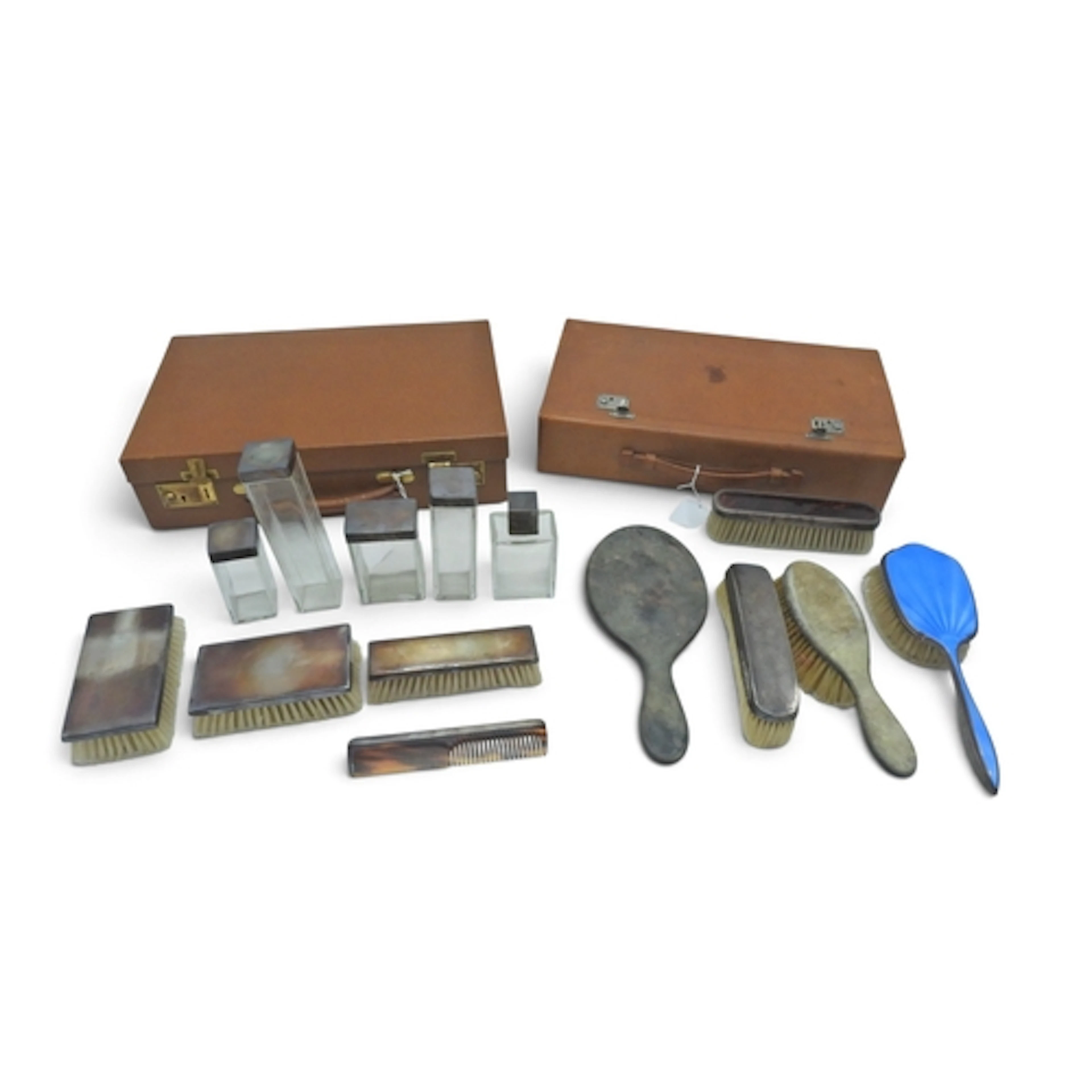 Two cases full of travelling accessories to include brushes,...