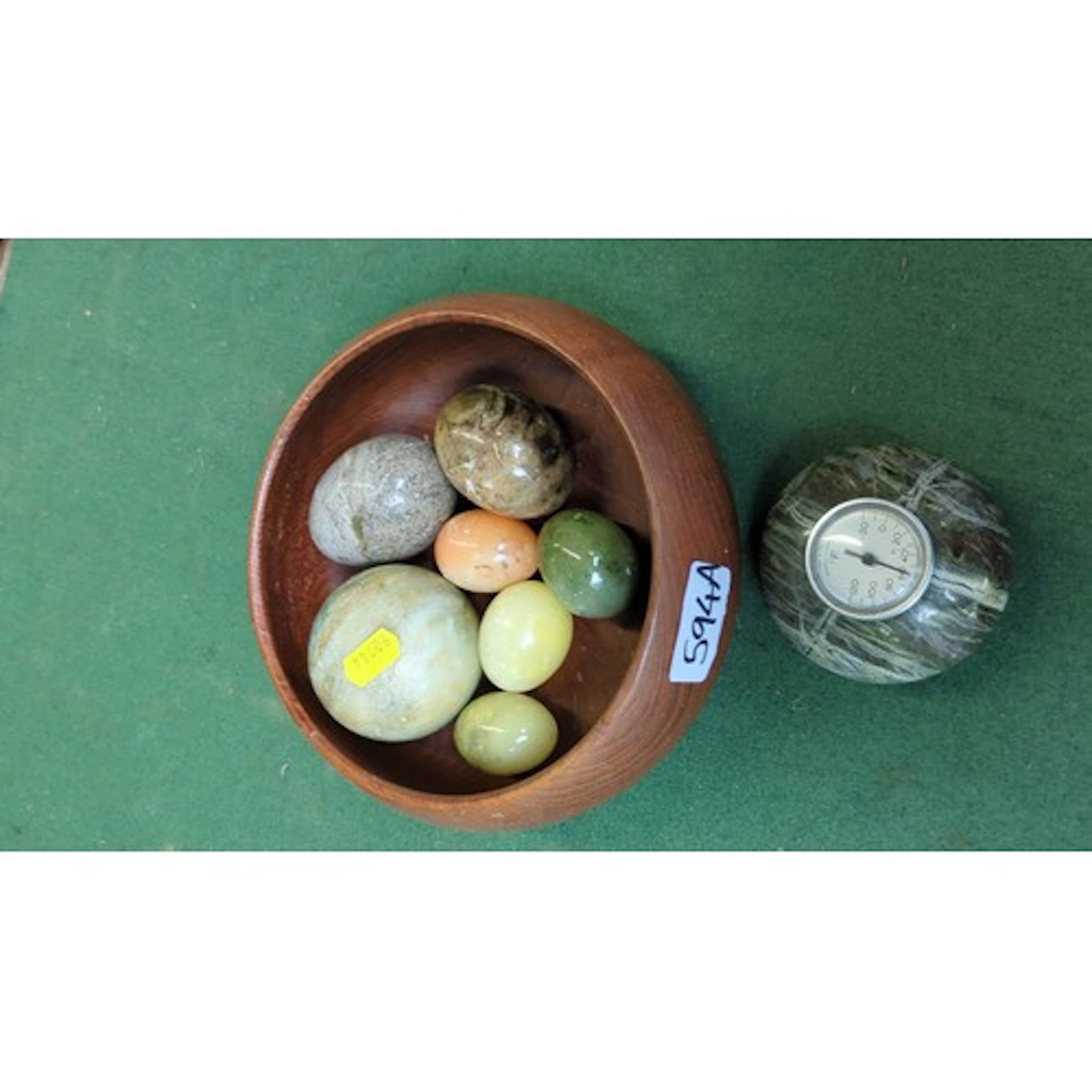A group of polished hardstone eggs in variegated tones, toge...