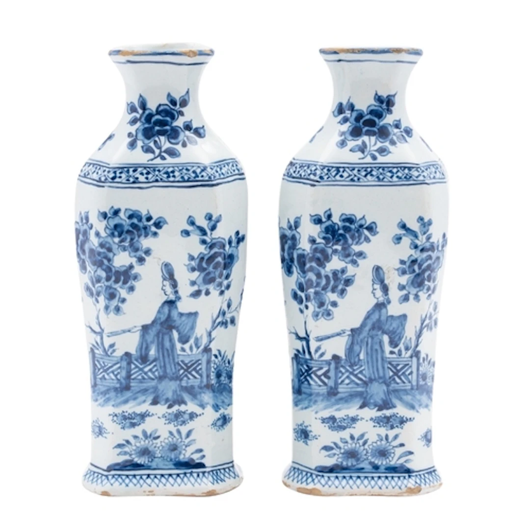 A pair of Dutch Delft pottery flasks of shouldered hexagonal...