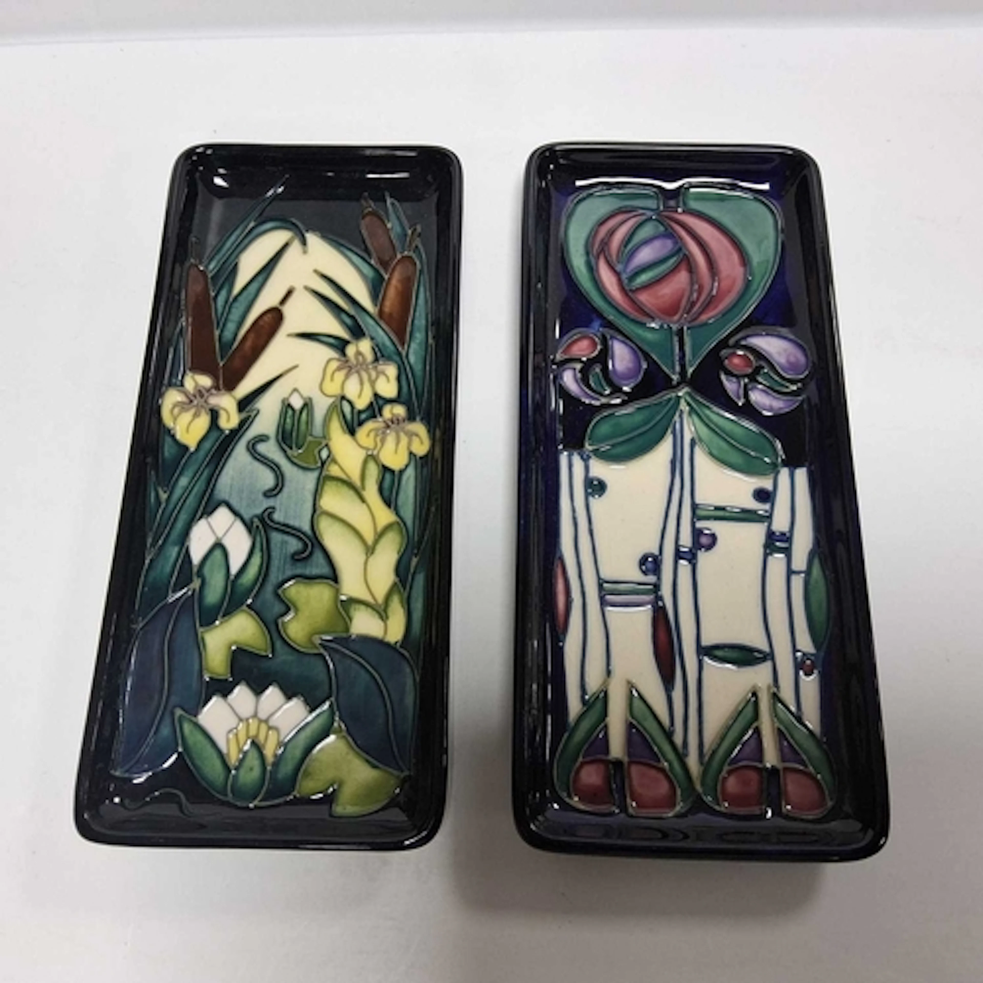 TWO MOORCROFT POTTERY RECTANGLE PEN PLATES, comprising, 'Tri...