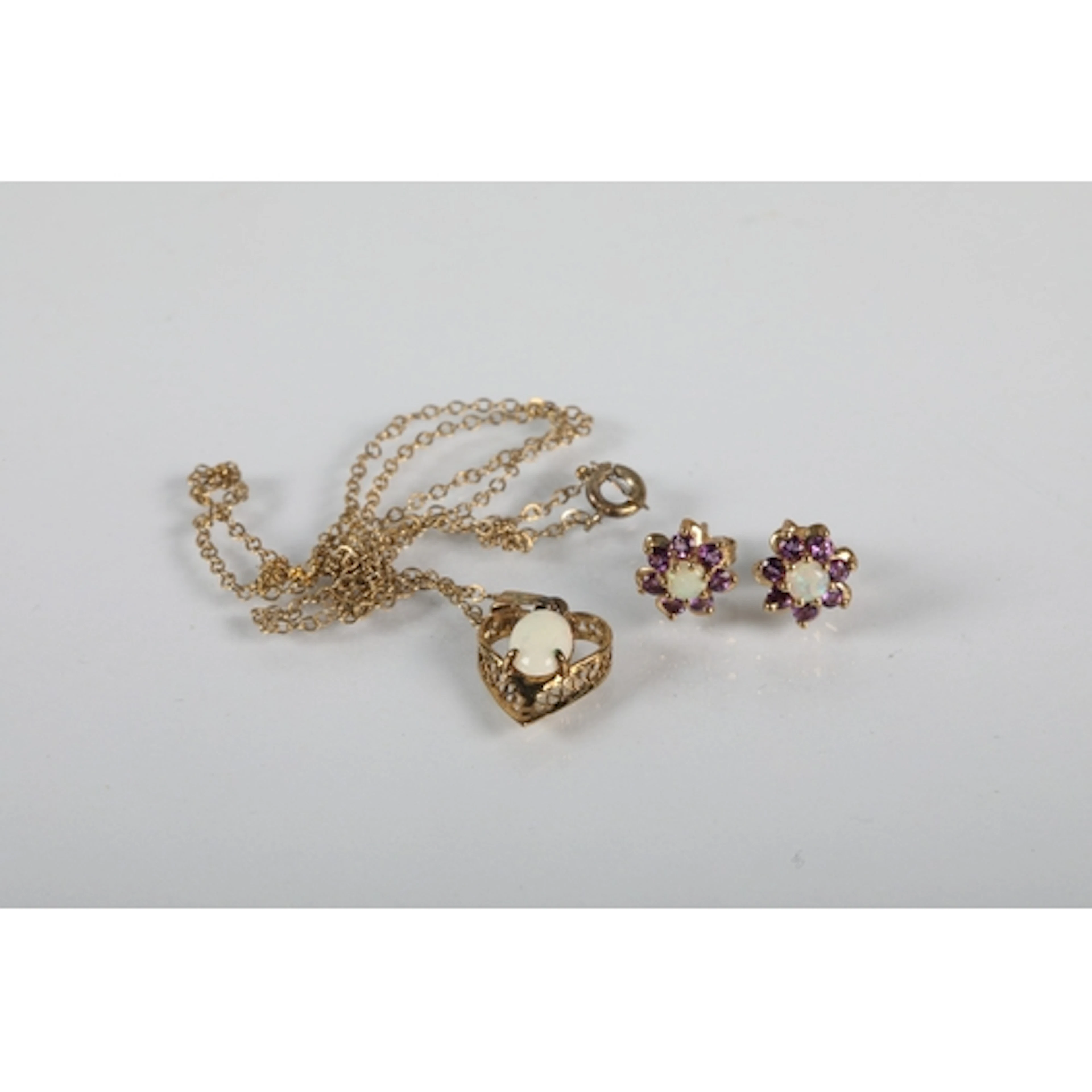 Silver mounted opal pendant chain and a pair of earrings.