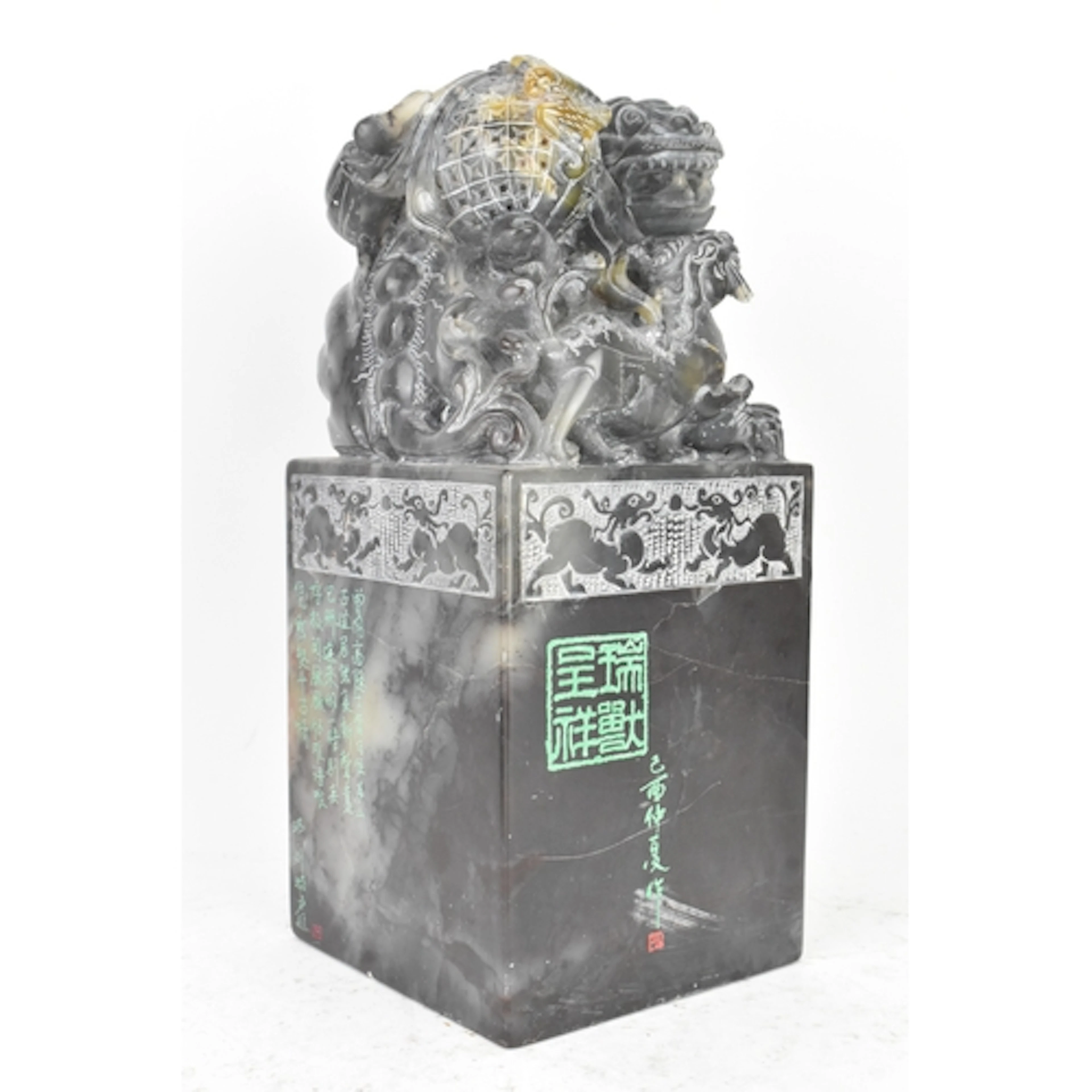 A large Chinese carved jade seal, of rectangular section sur...