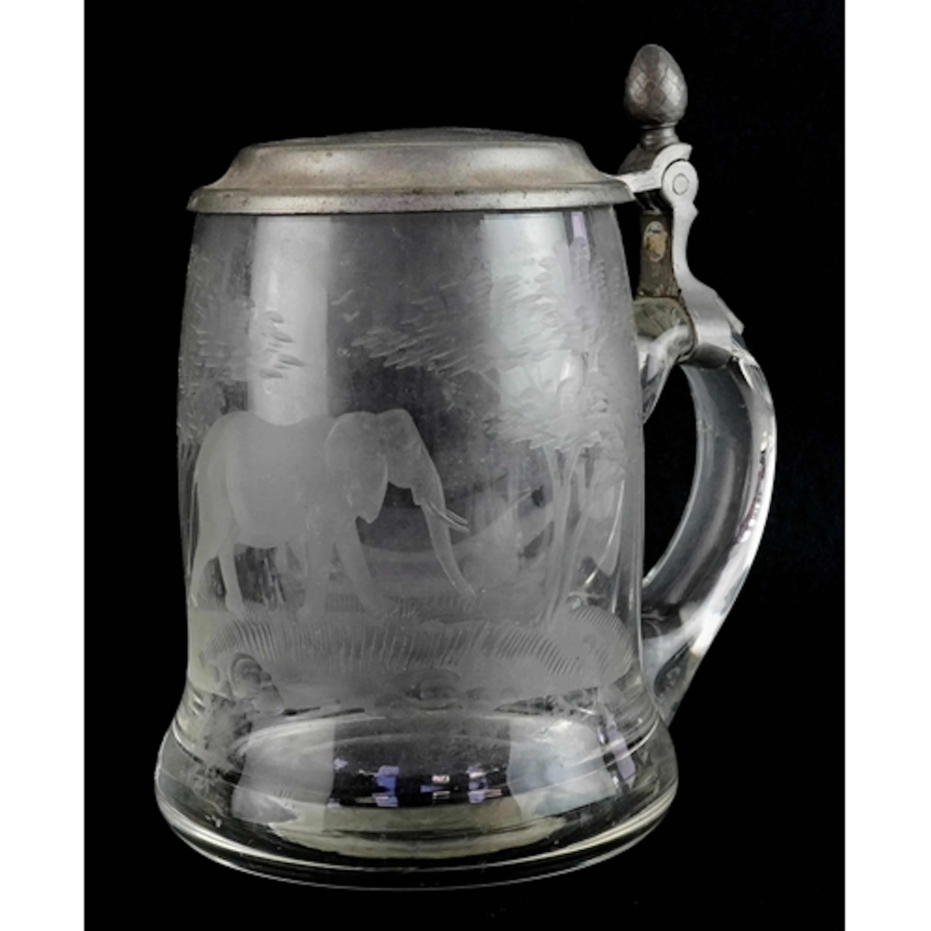 Antique glass stein acid etched with an elephant amongst tre...