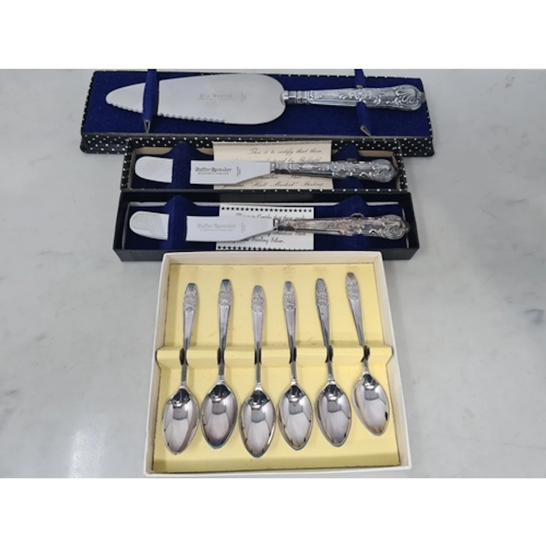 A modern silver handled Pie Sever, two silver handled Butter...