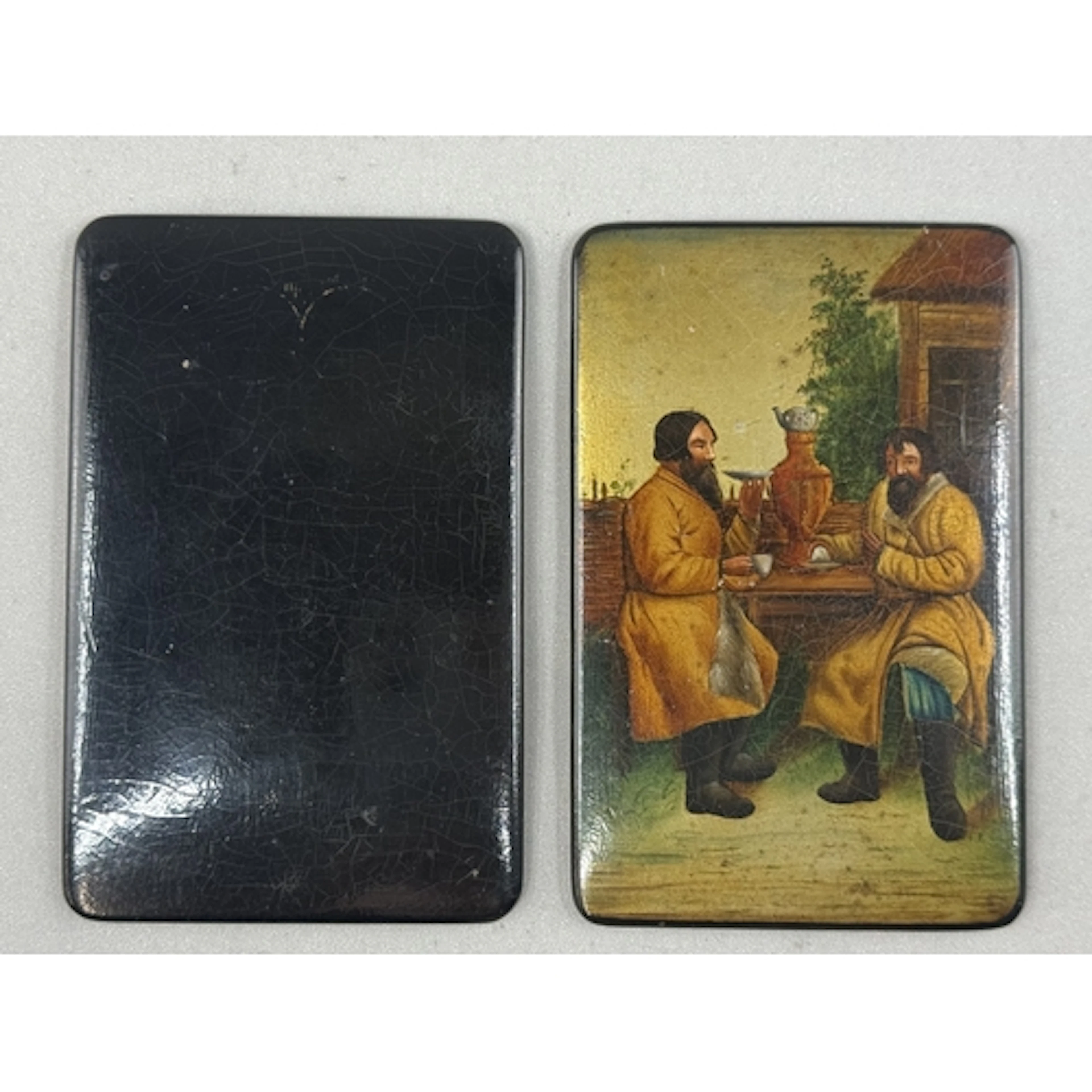 Decorative Arts: a pair of Russian papier mache notebook cov...