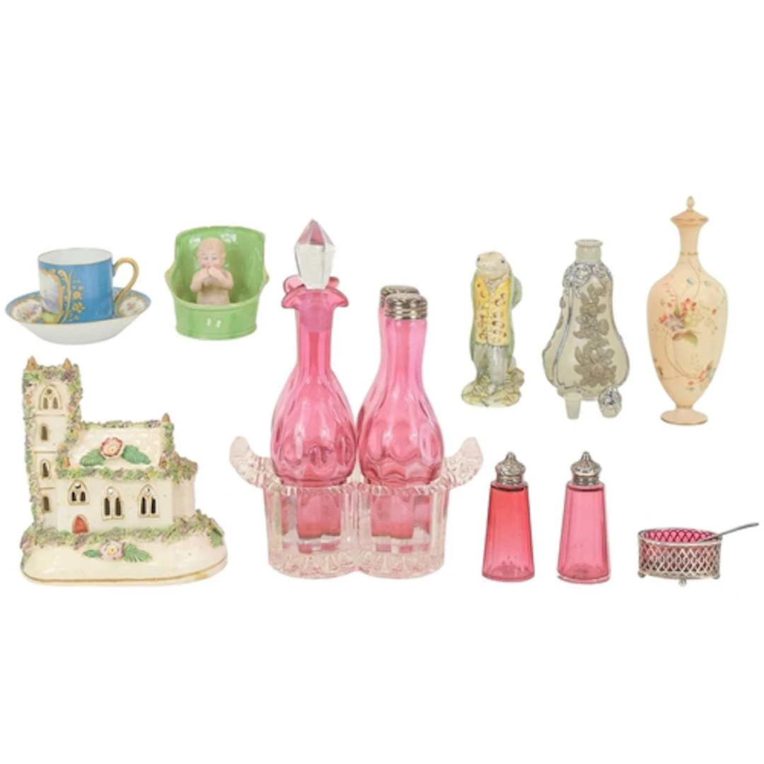 A Victorian four piece cranberry glass cruet set. With a mou...