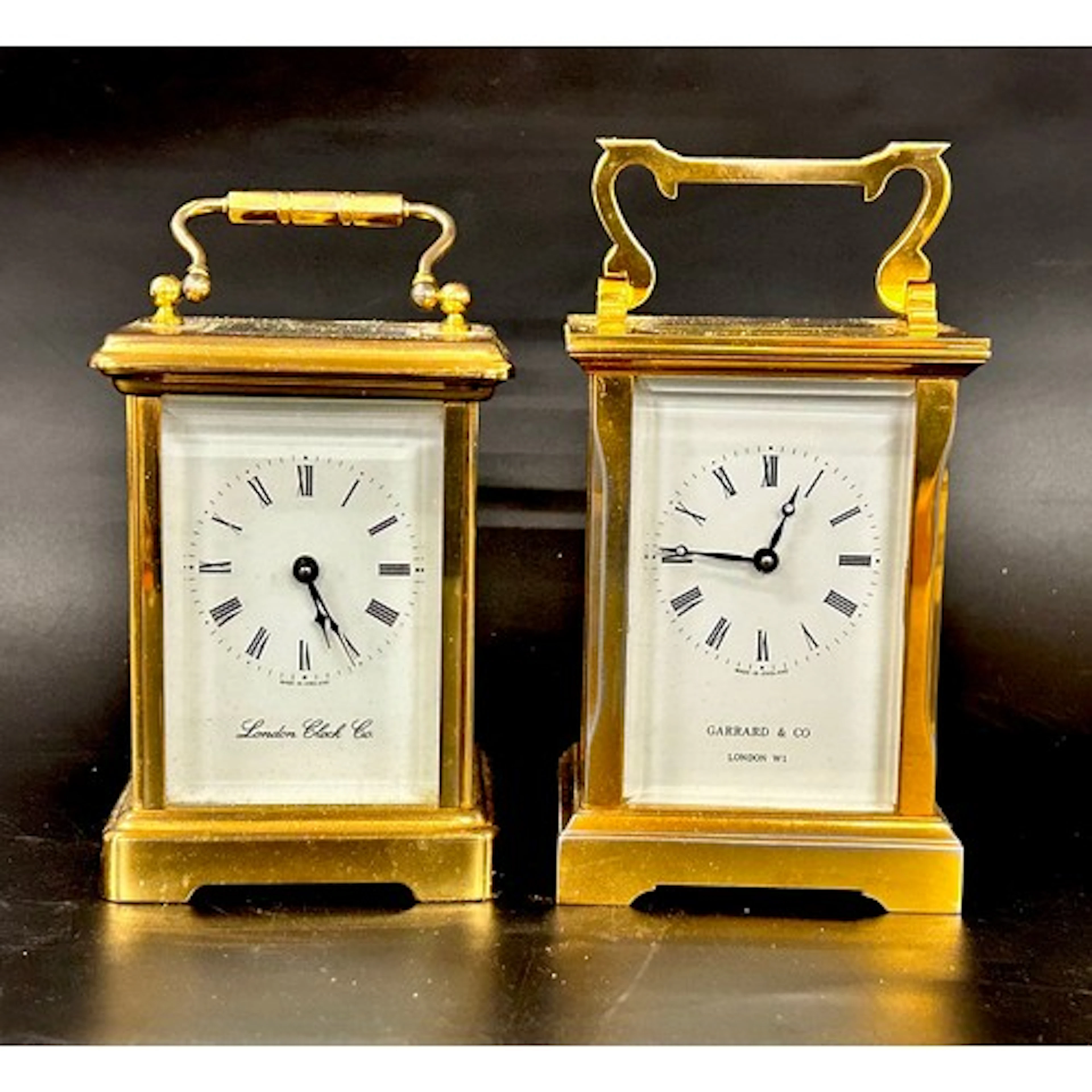 Two brass carriage clocks, Garrard & Co., and the London Clo...