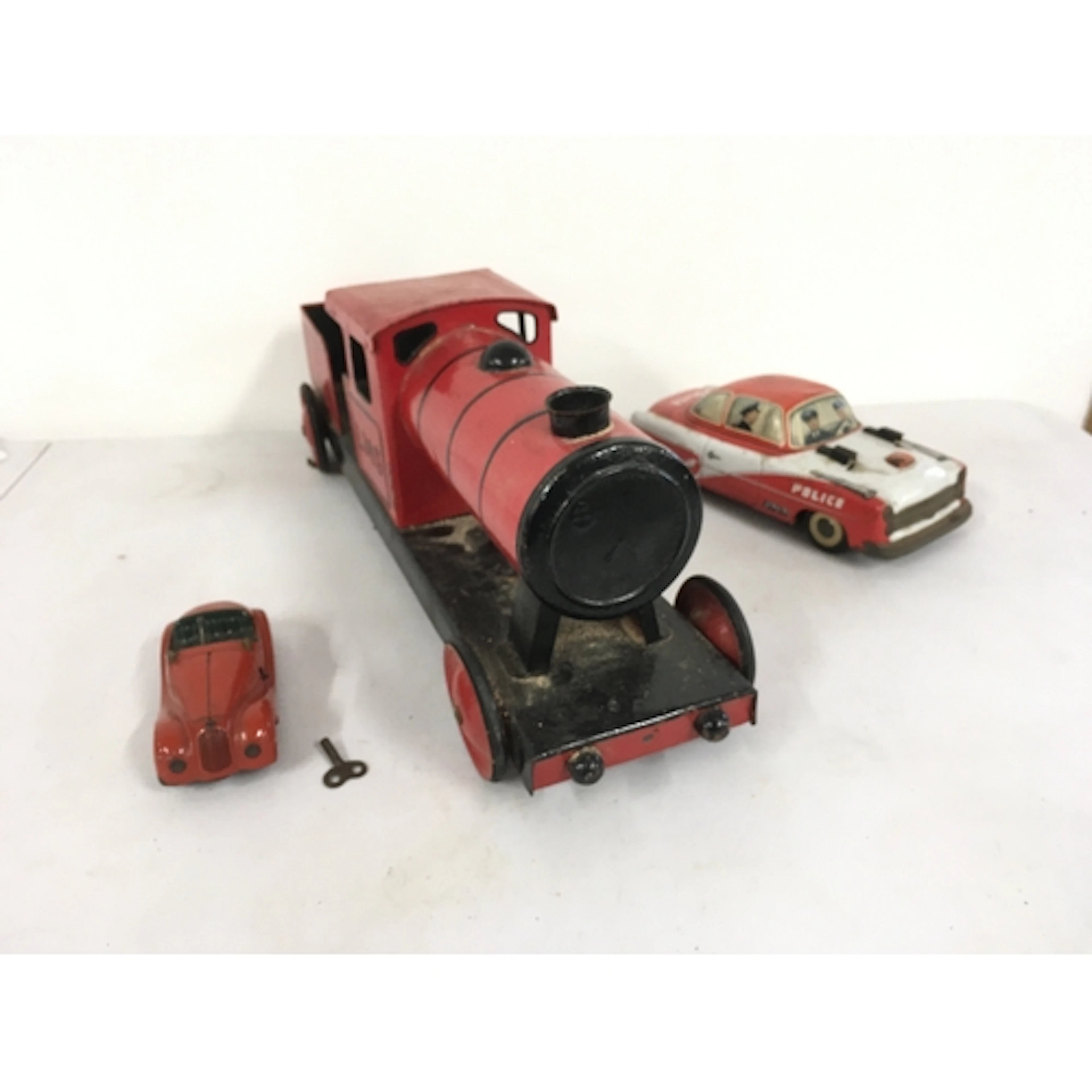 3x tin model vehicles including 1x Schuco Examico 4001 clock...