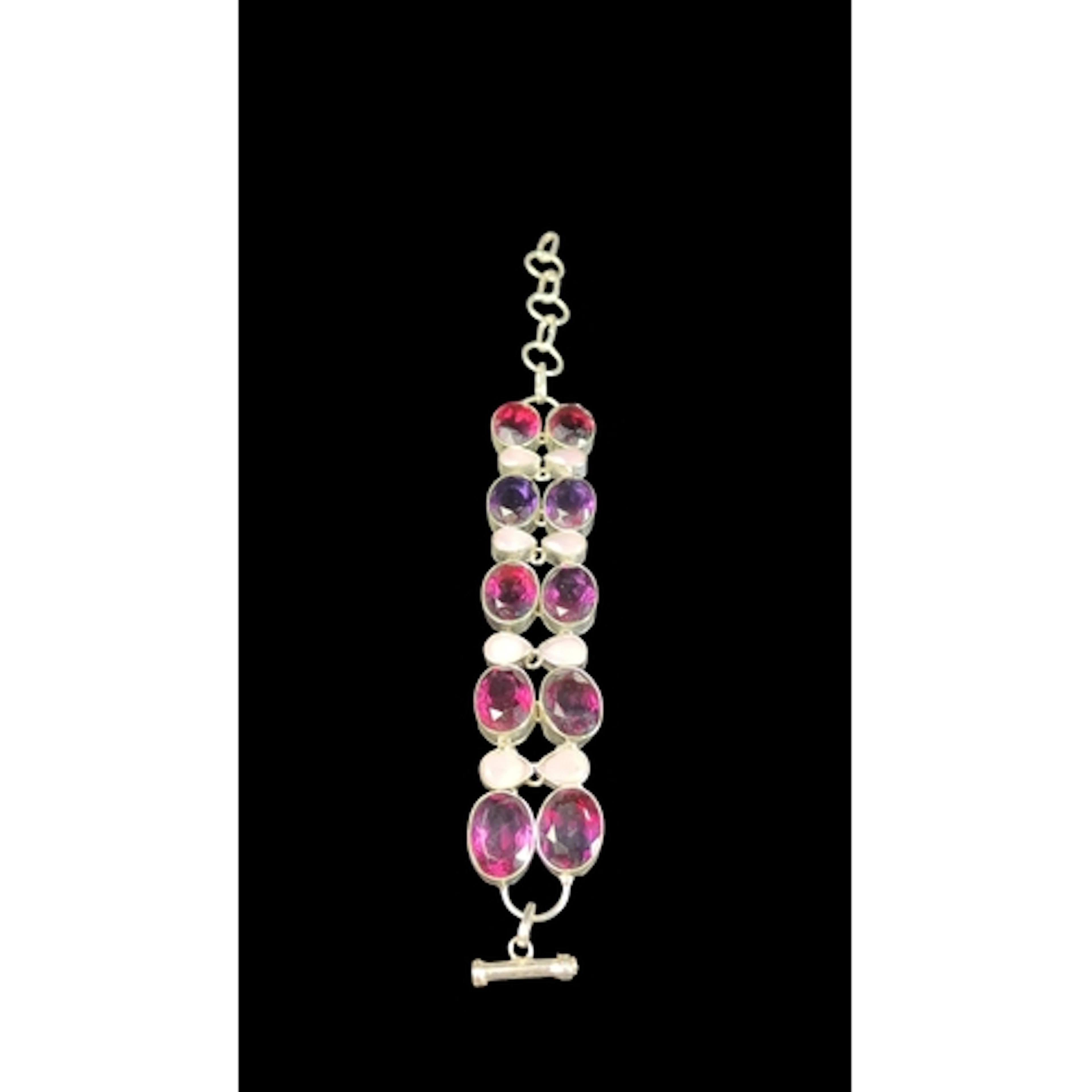 Silver bracelet with two rows of bezel-set oval pink and pur...