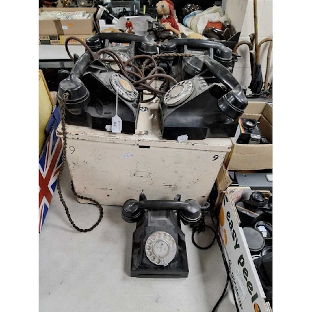 A GROUP OF FIVE VINTAGE BAKELITE ROTARY DIAL TELEPHONES AND ...