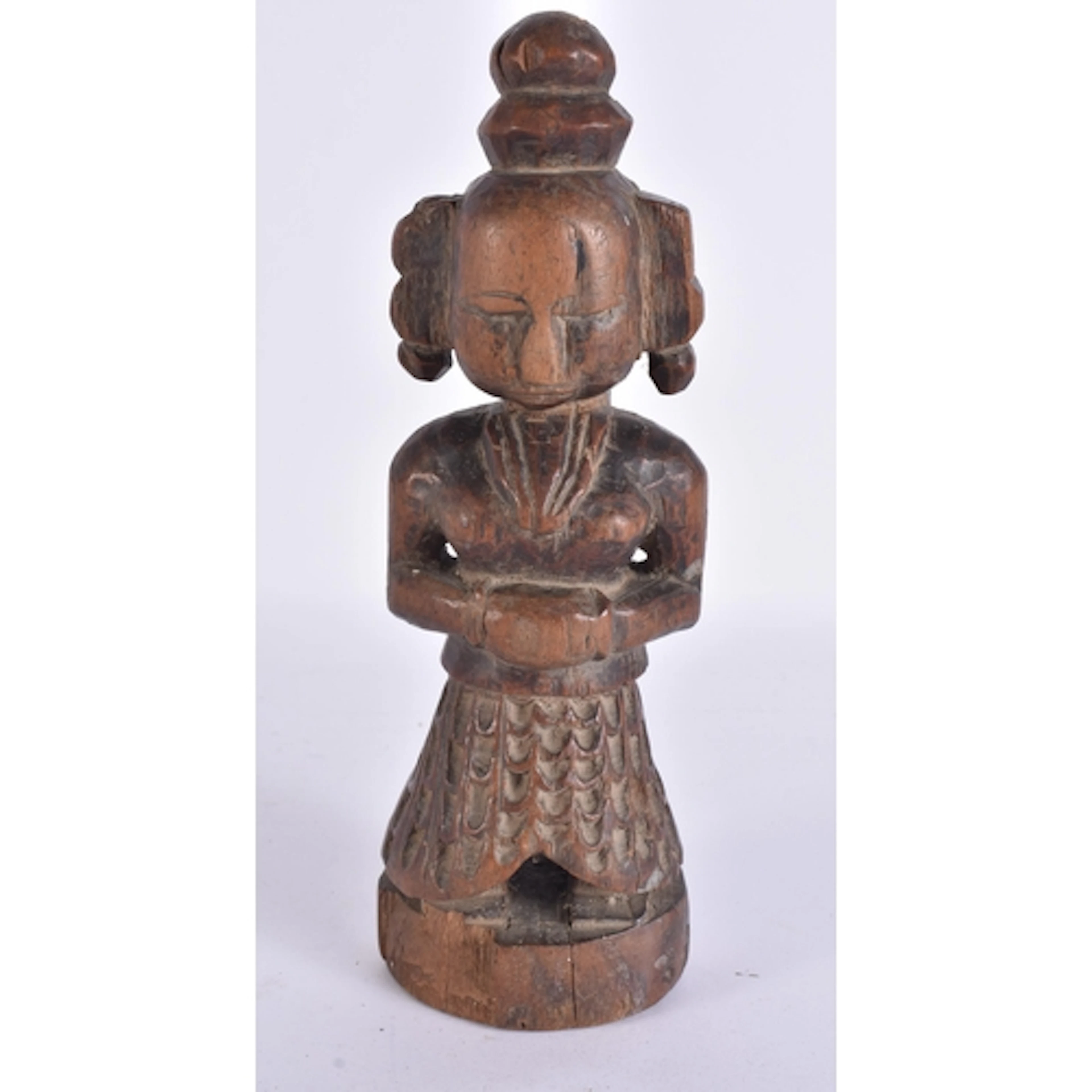 A 17TH/18TH CENTURY INDIAN CARVED WOOD DEITY. 23 cm high.