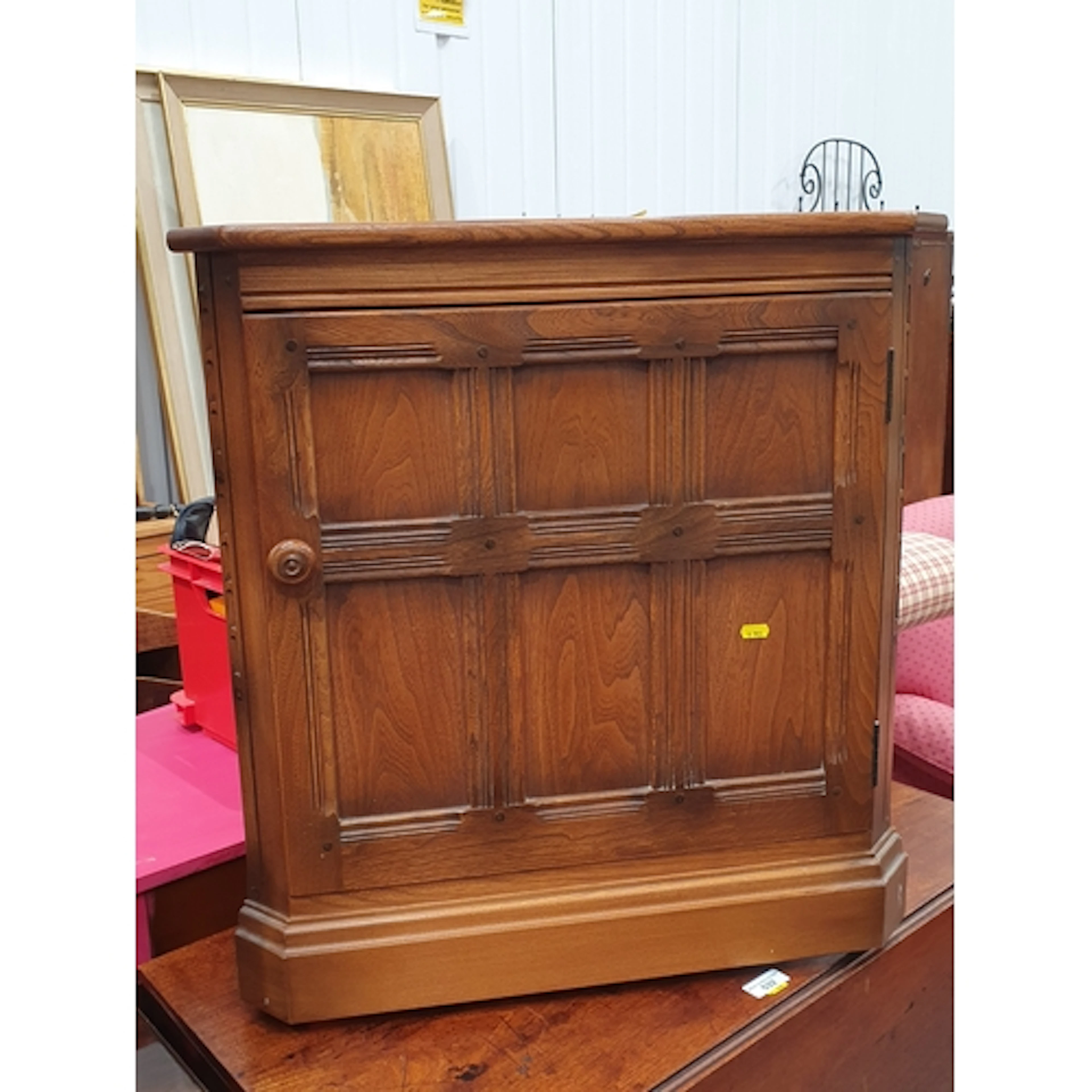 A small Ercol single door corner Cupboard, (R6).
