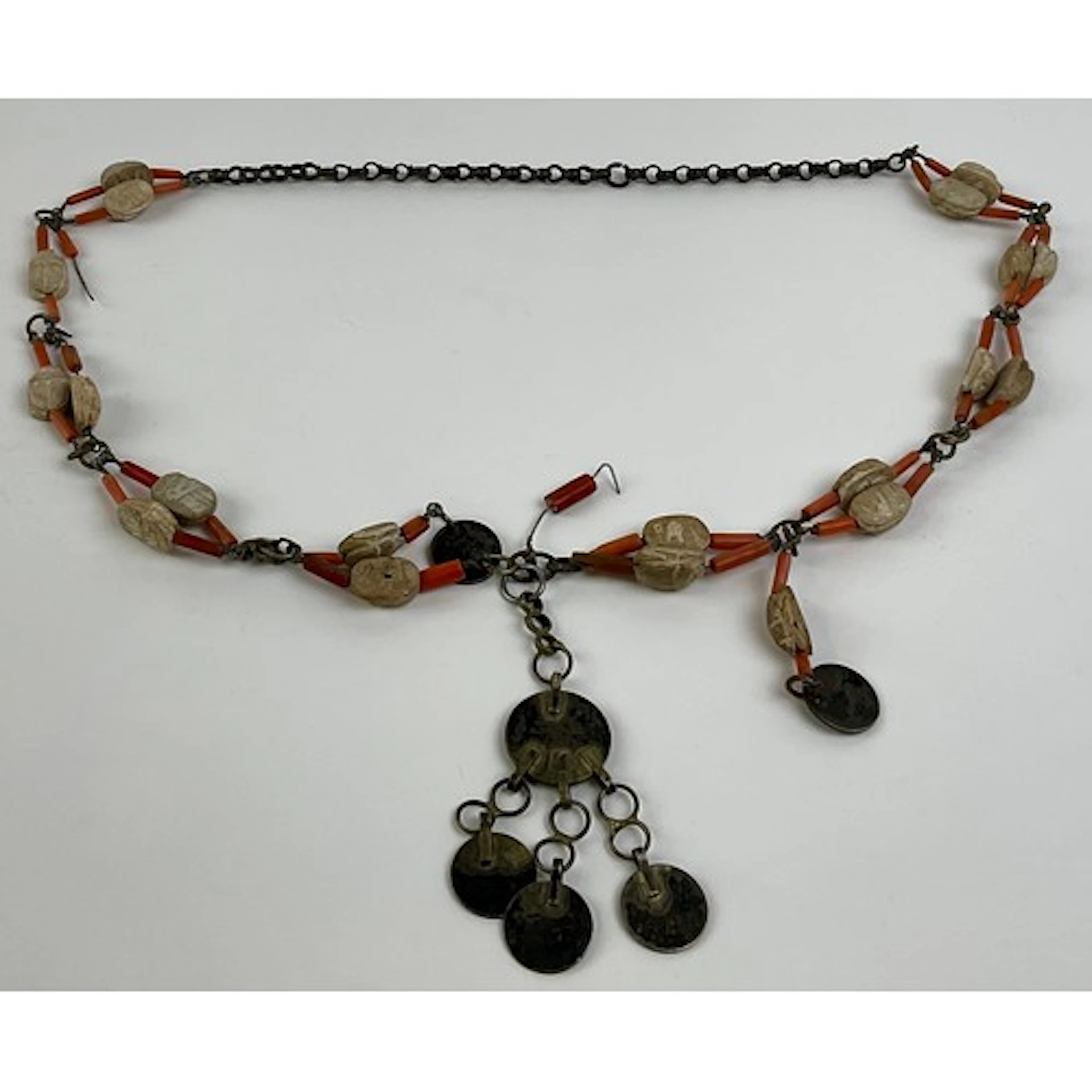An Egyptian necklace, composed of earthenware scarabs, coral...