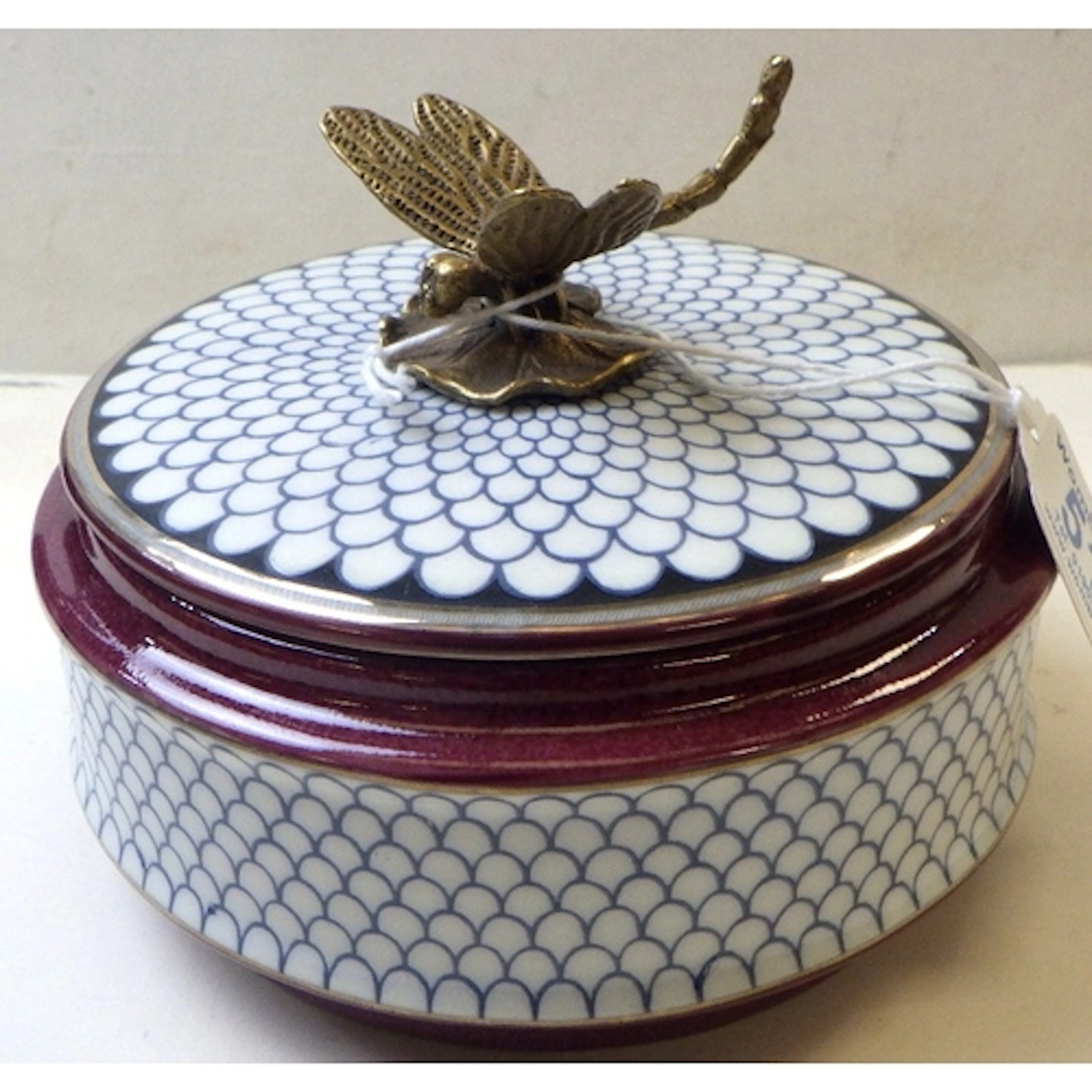 A reproduction Russian style porcelain trinket box with a mo...