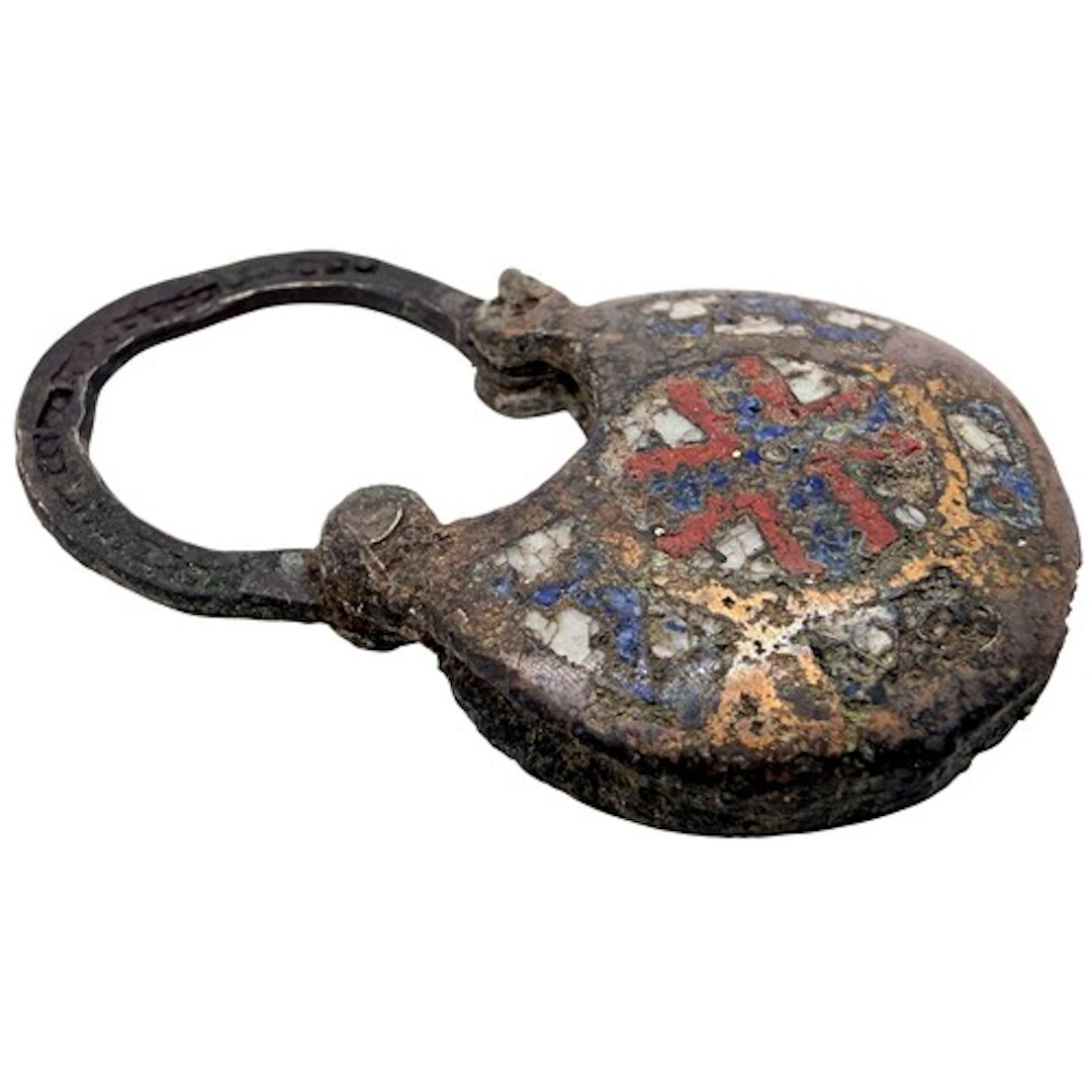 A Byzantine enamelled bronze bifacial temple pendant, Easter...