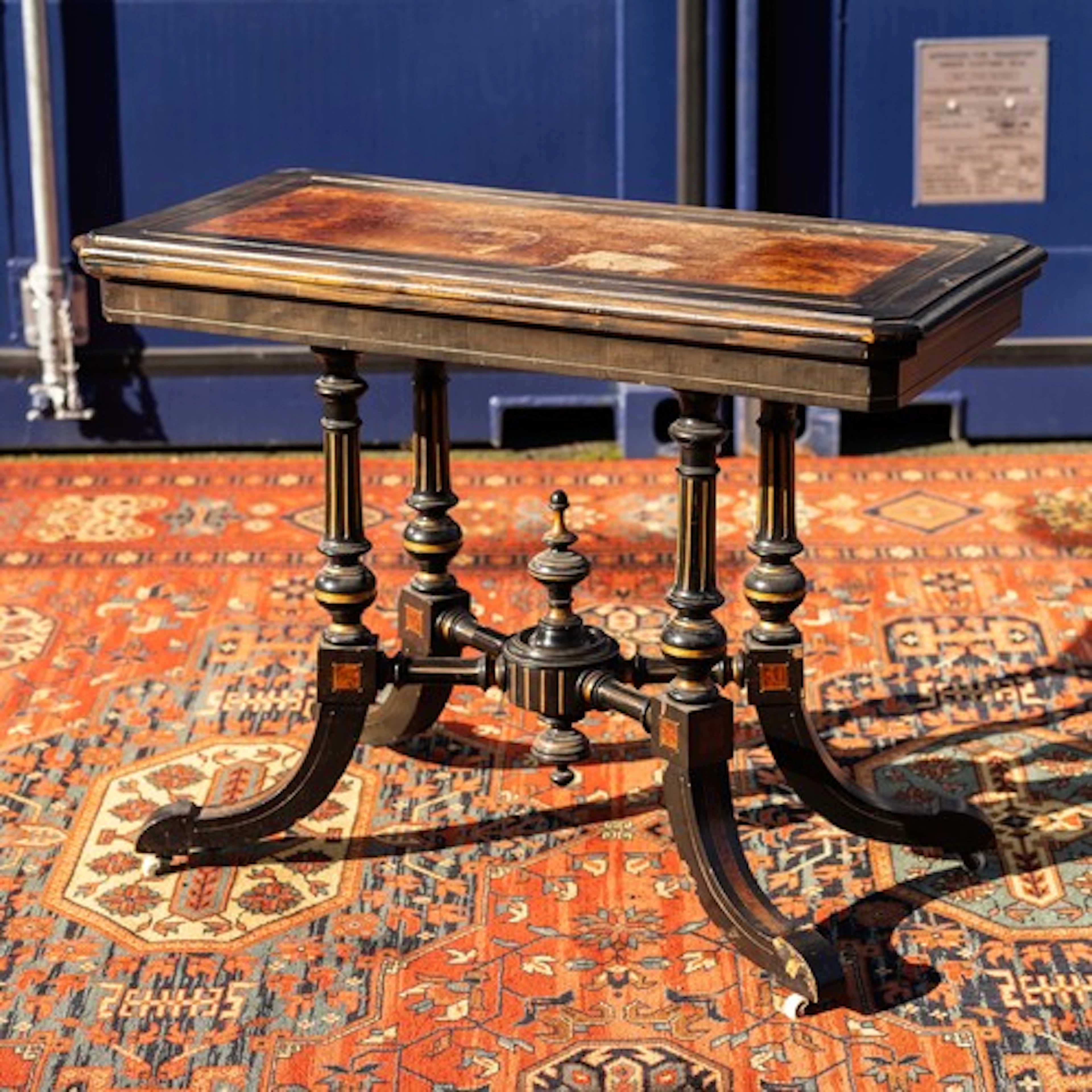 A Victorian Aaesthetic design fold over card table, ebonised...