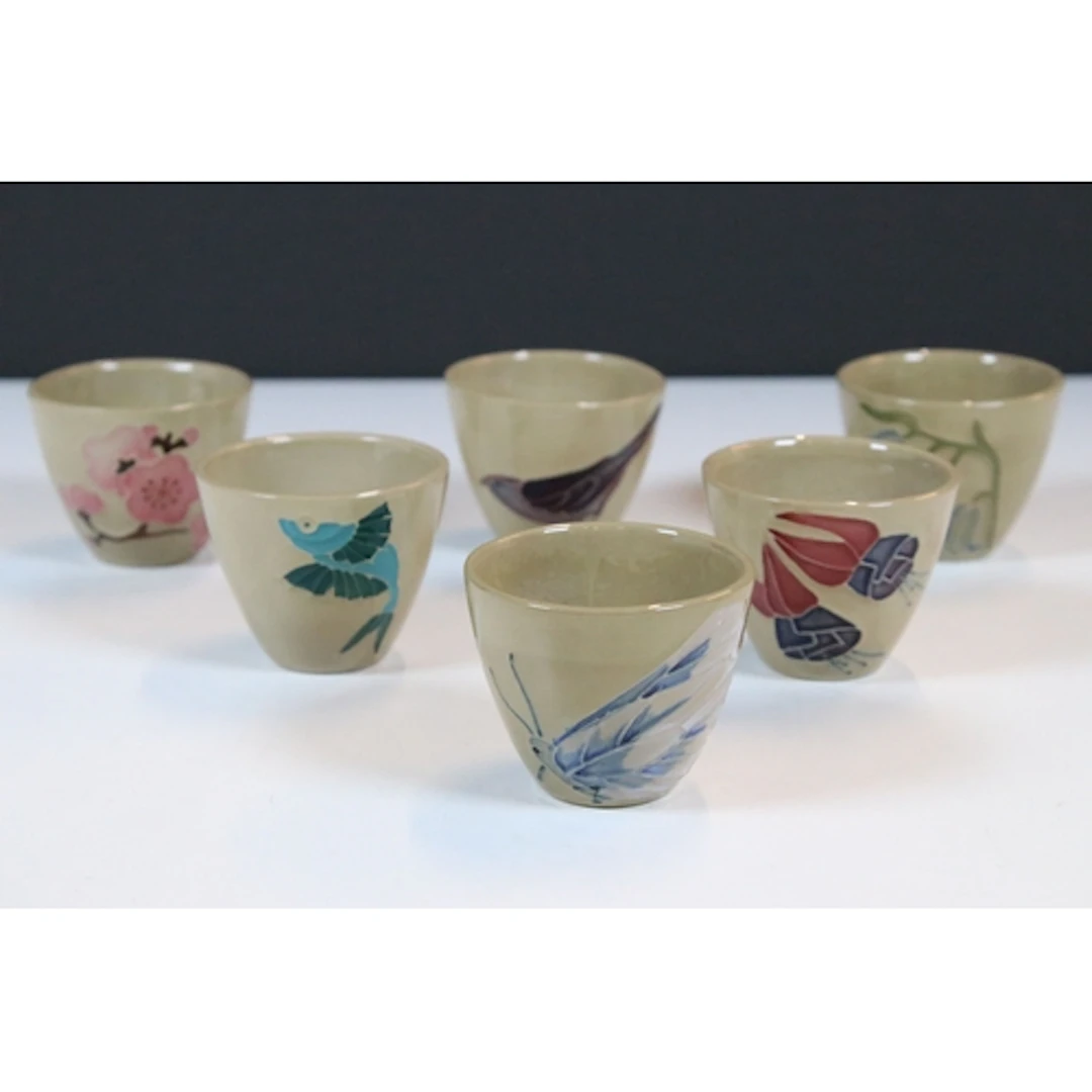 Set of six Moorcroft saki or sake cups, in varying designs, ...