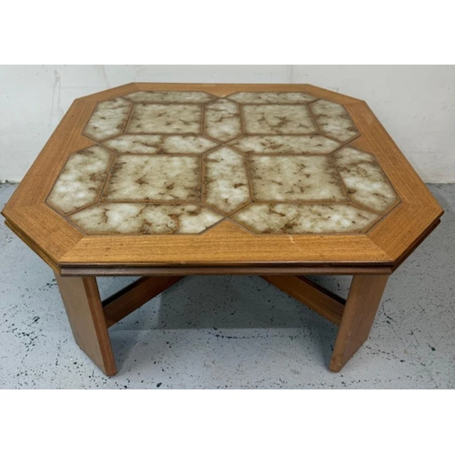An octagonal tile topped mid-century coffee table