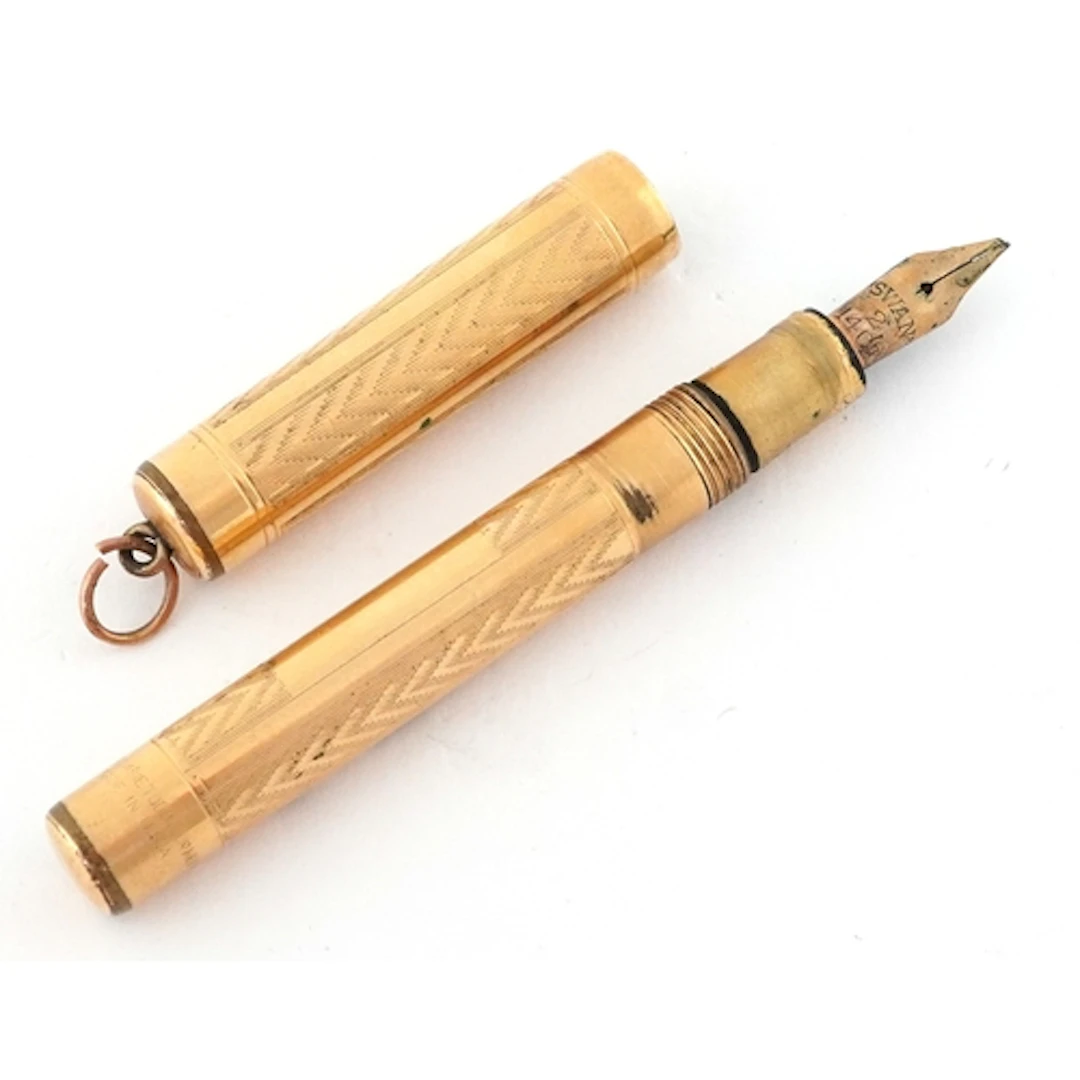 Swan-Mabie Todd, gold plated engine turned fountain pen with...