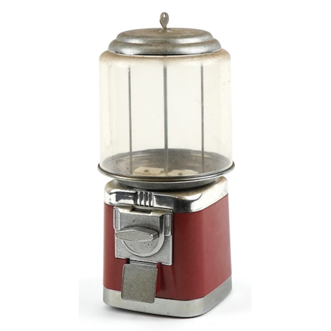 Vintage coin operated candy vending machine with clear globe...