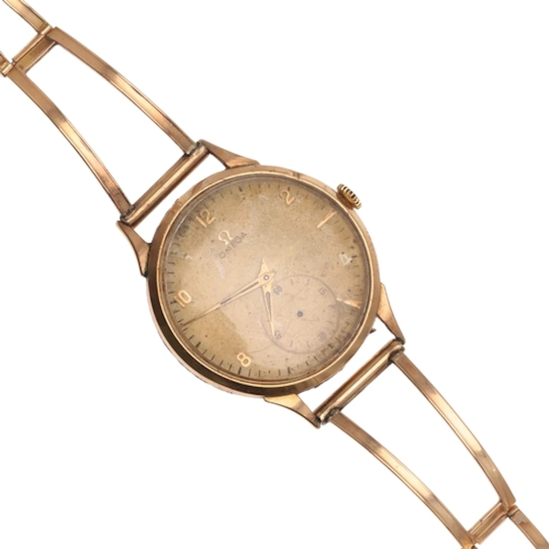 AN 18CT GOLD MECHANICAL WRISTWATCH BY OMEGA. the signed gold...