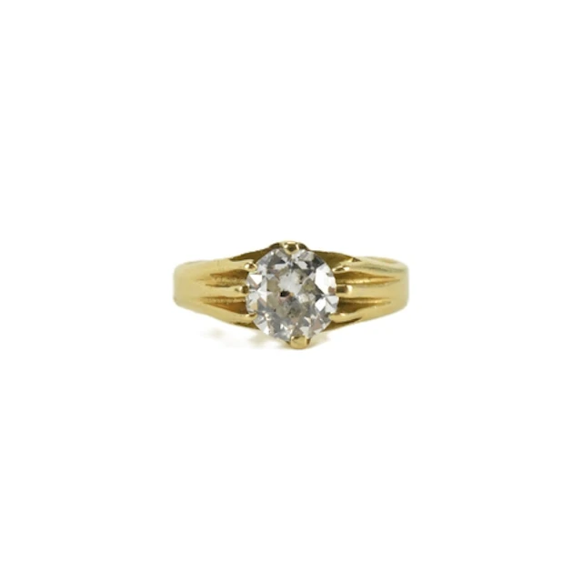 A mid 20th century solitaire diamond and yellow metal ring, ...