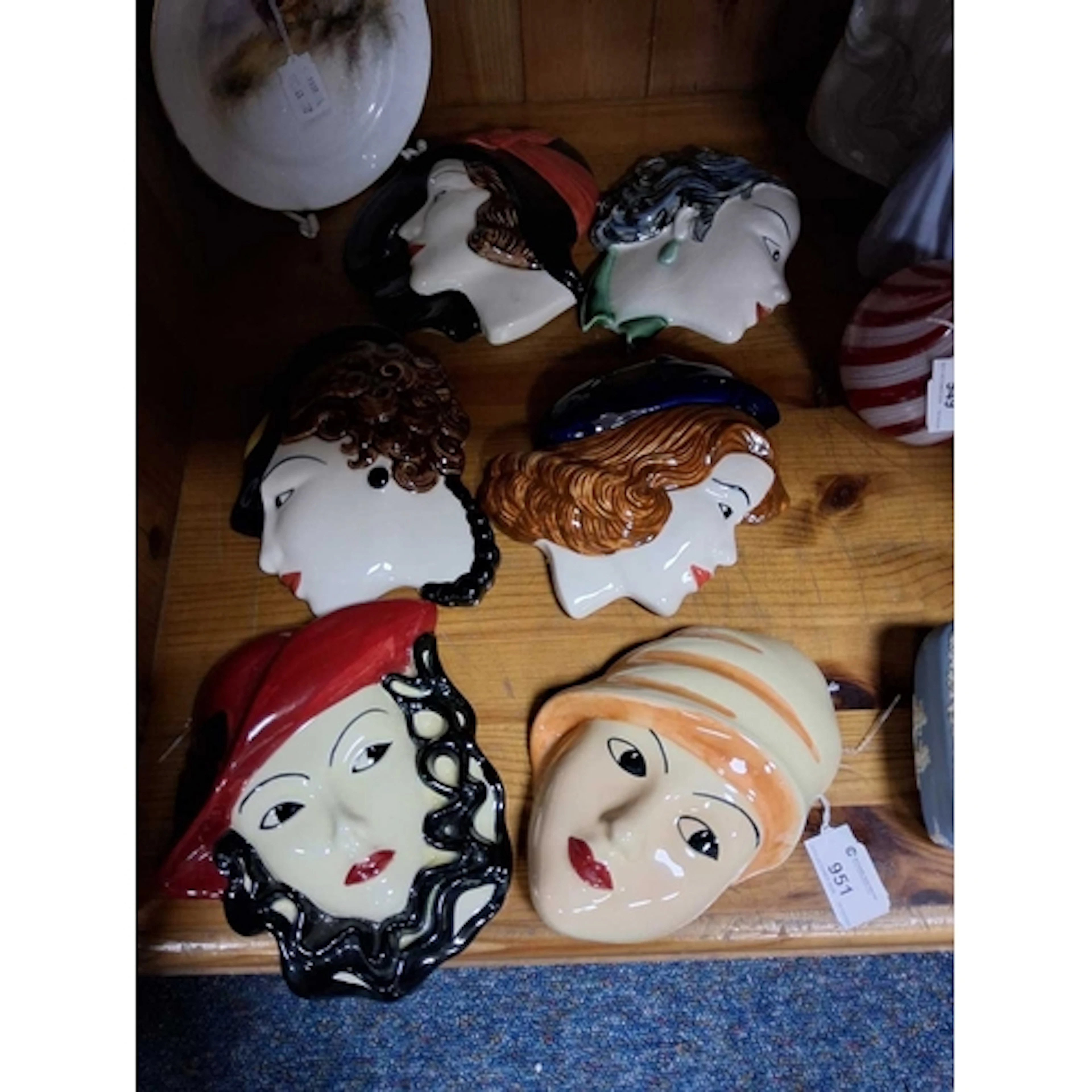 A SMALL GROUP OF SIX ART DECO STYLE WALL MASKS from Moorland...