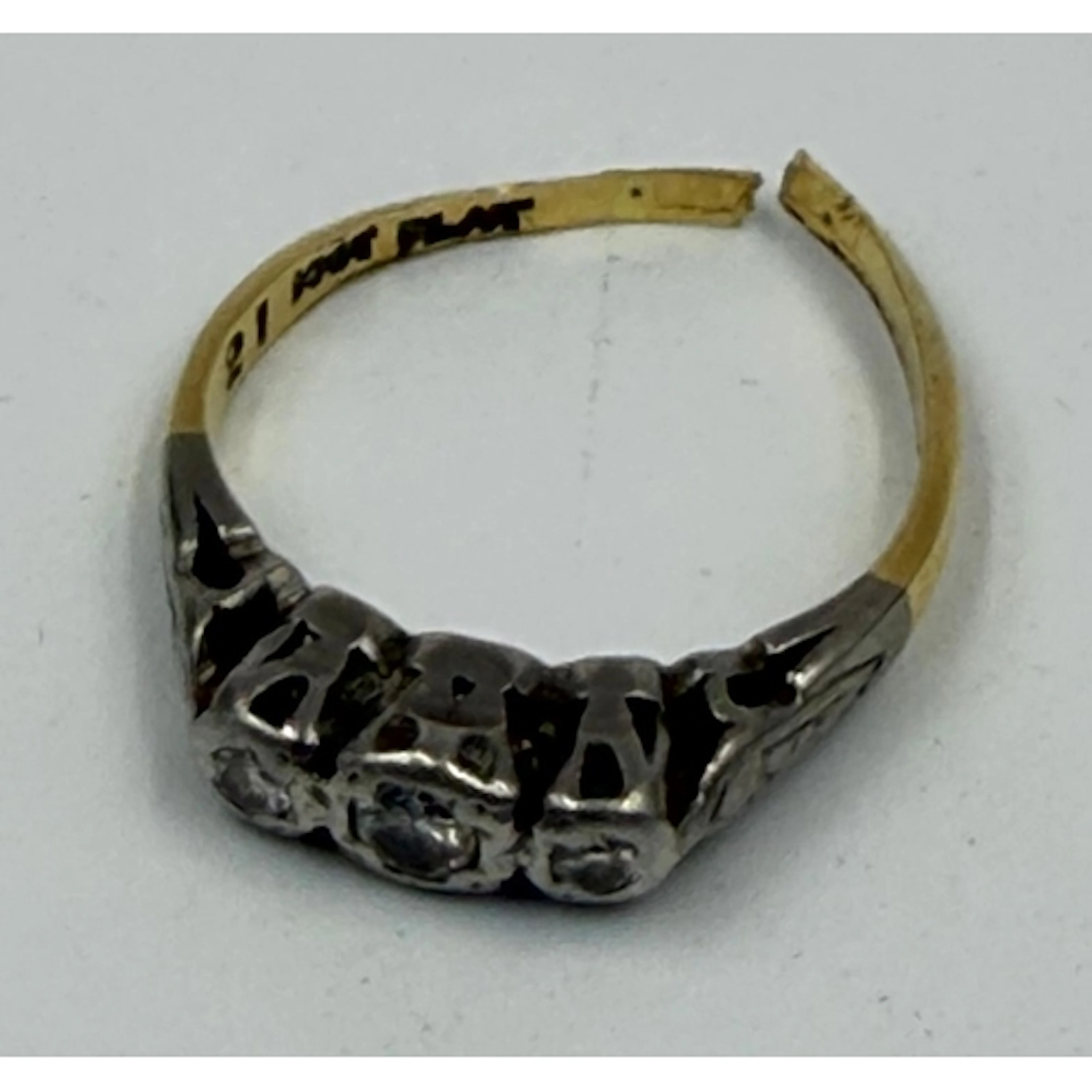 A three stone diamond ring in 18ct gold and platinum AF, app...