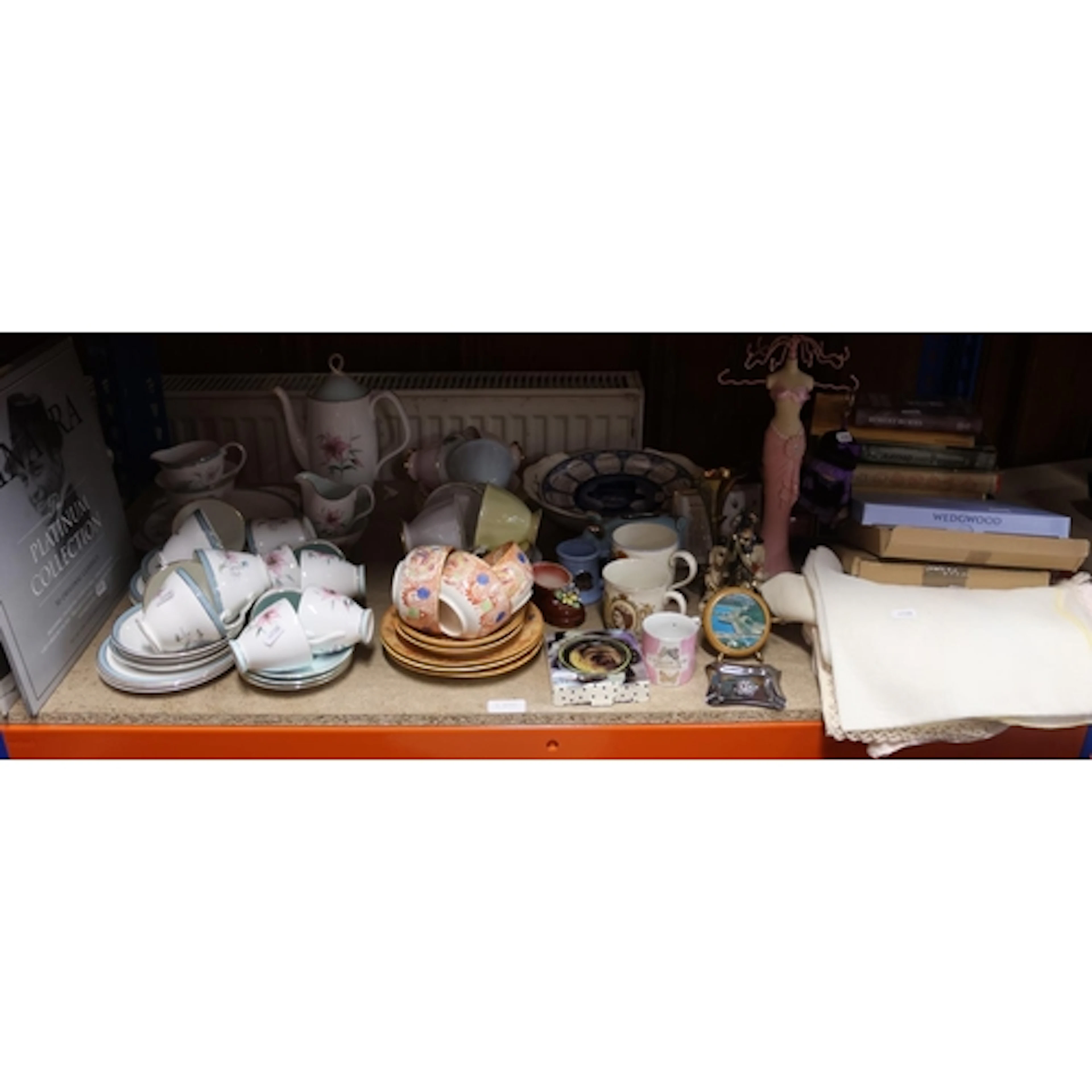 Shelf containing decorative ceramics to include part teasets...